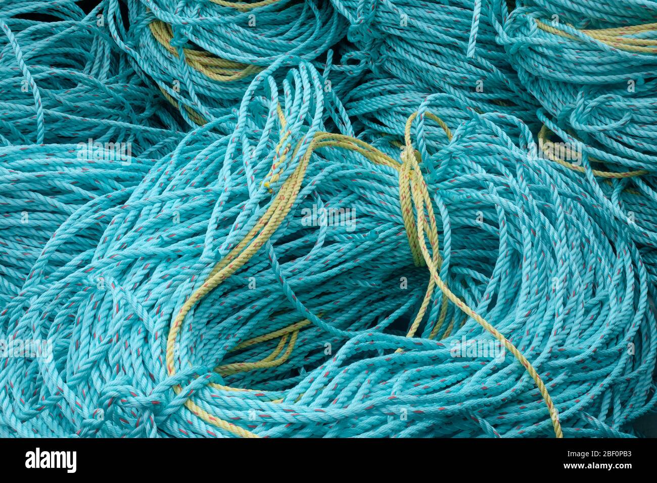 fishermen's rope coiled up on the harbourside Stock Photo - Alamy