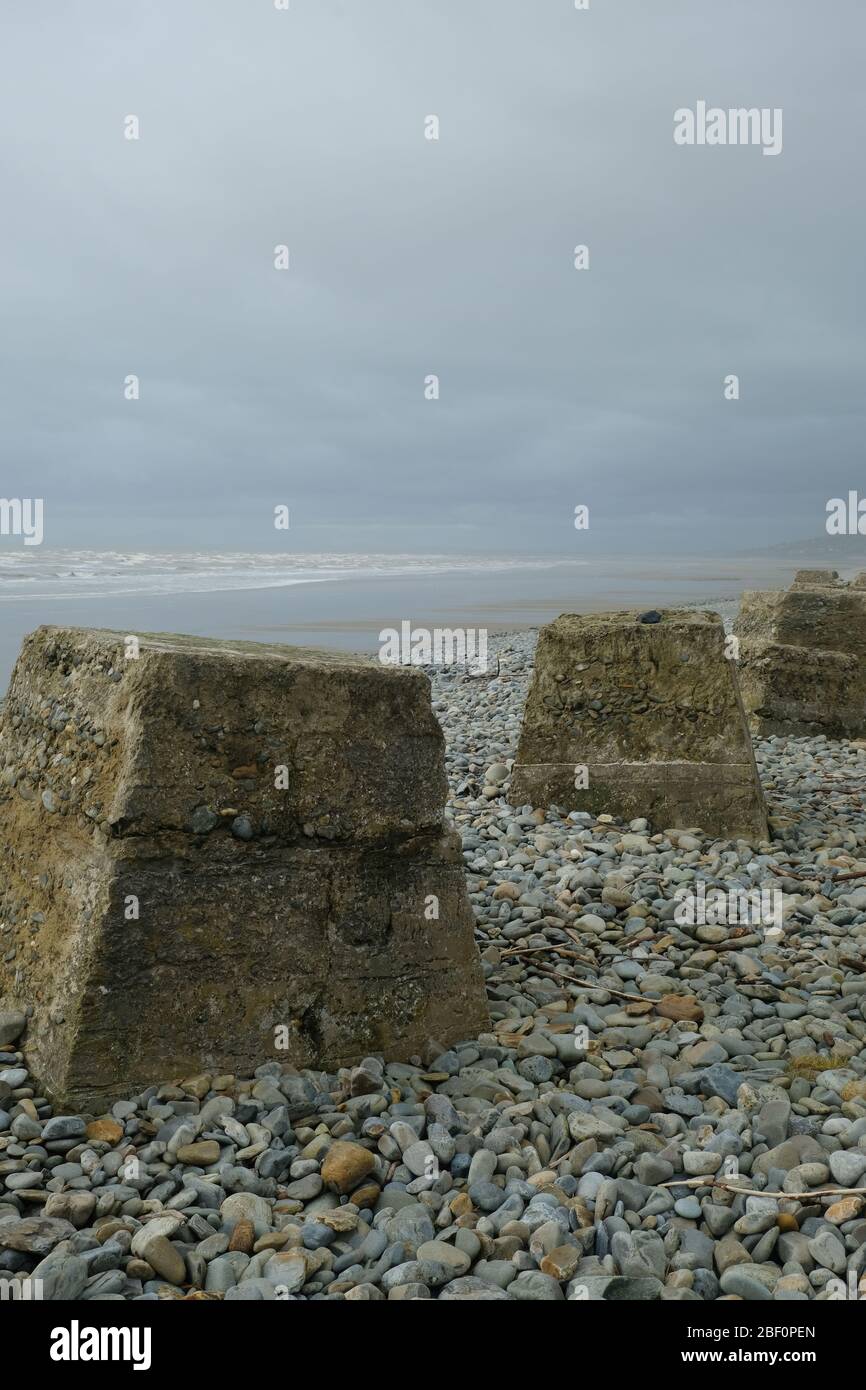 World War 2 Tank Traps on the beach at Fairbourne on the NW coast of Wales Stock Photo