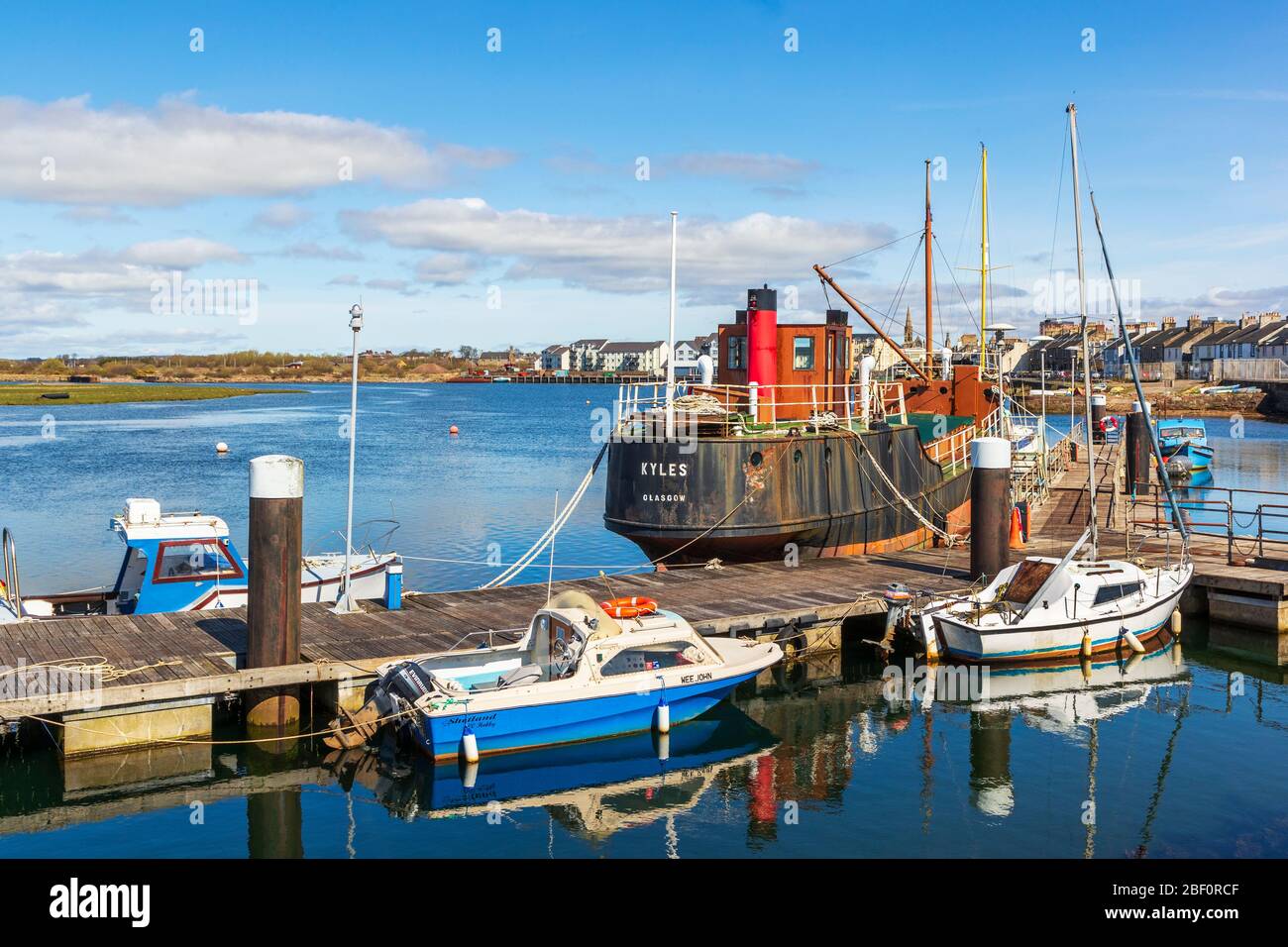 Irvine harbour with Kyles puffer boat, an exhibit at the maritime museum,  at the pier, Ayrshire, Scotland, UK Stock Photo