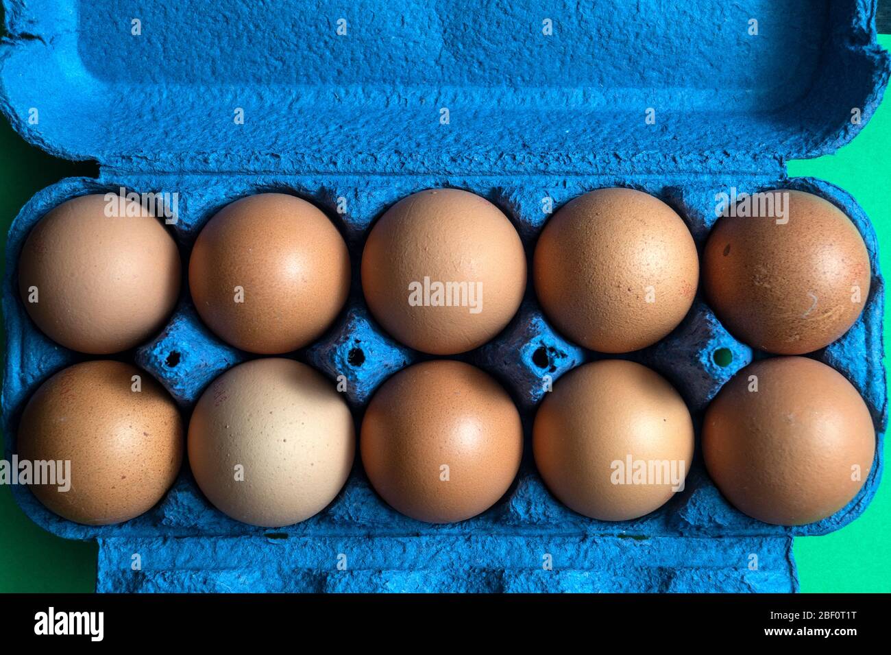 Organic brown chicken eggs in carton on rustic wooden table backgrounds, natural healthy food concepts Stock Photo