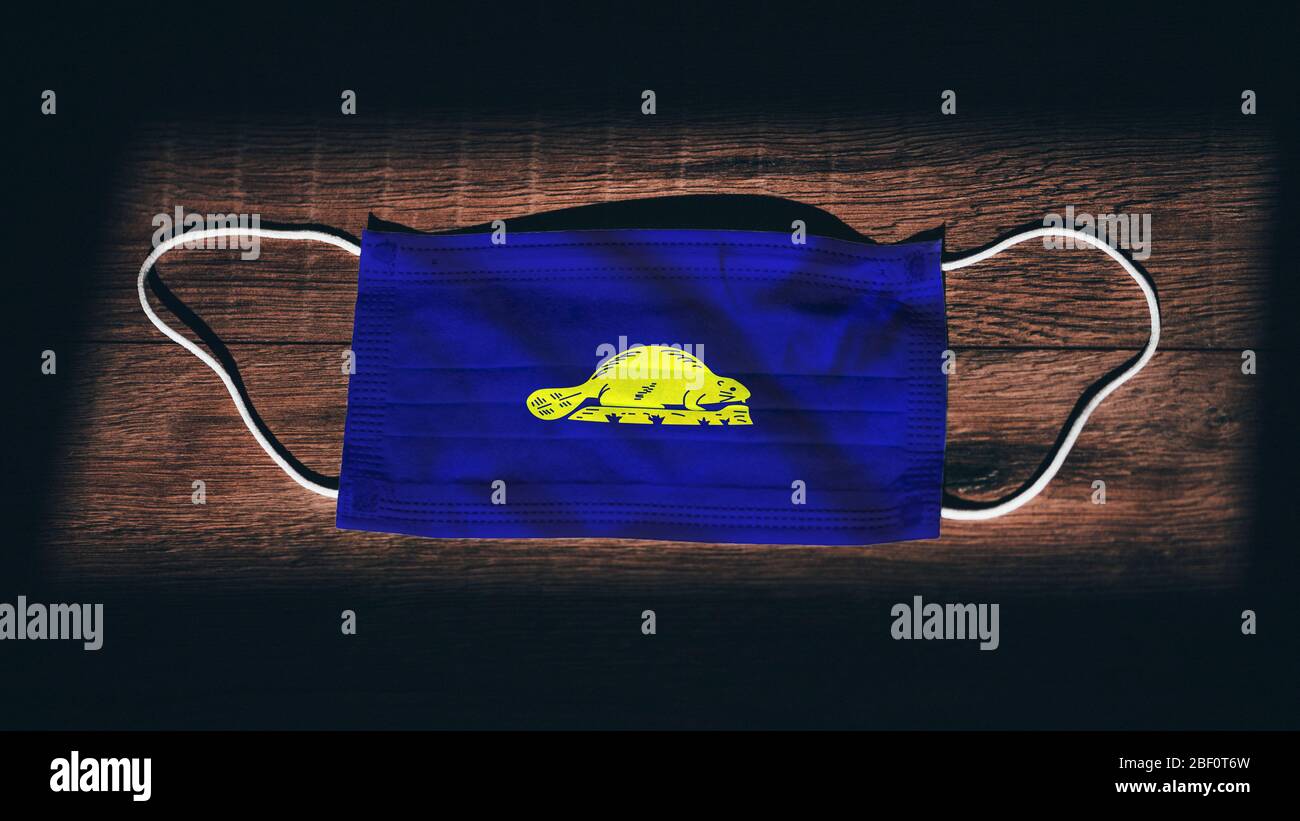 Oregon (reverse) Flag. Coronavirus Covid 19 in U.S. State. Medical mask