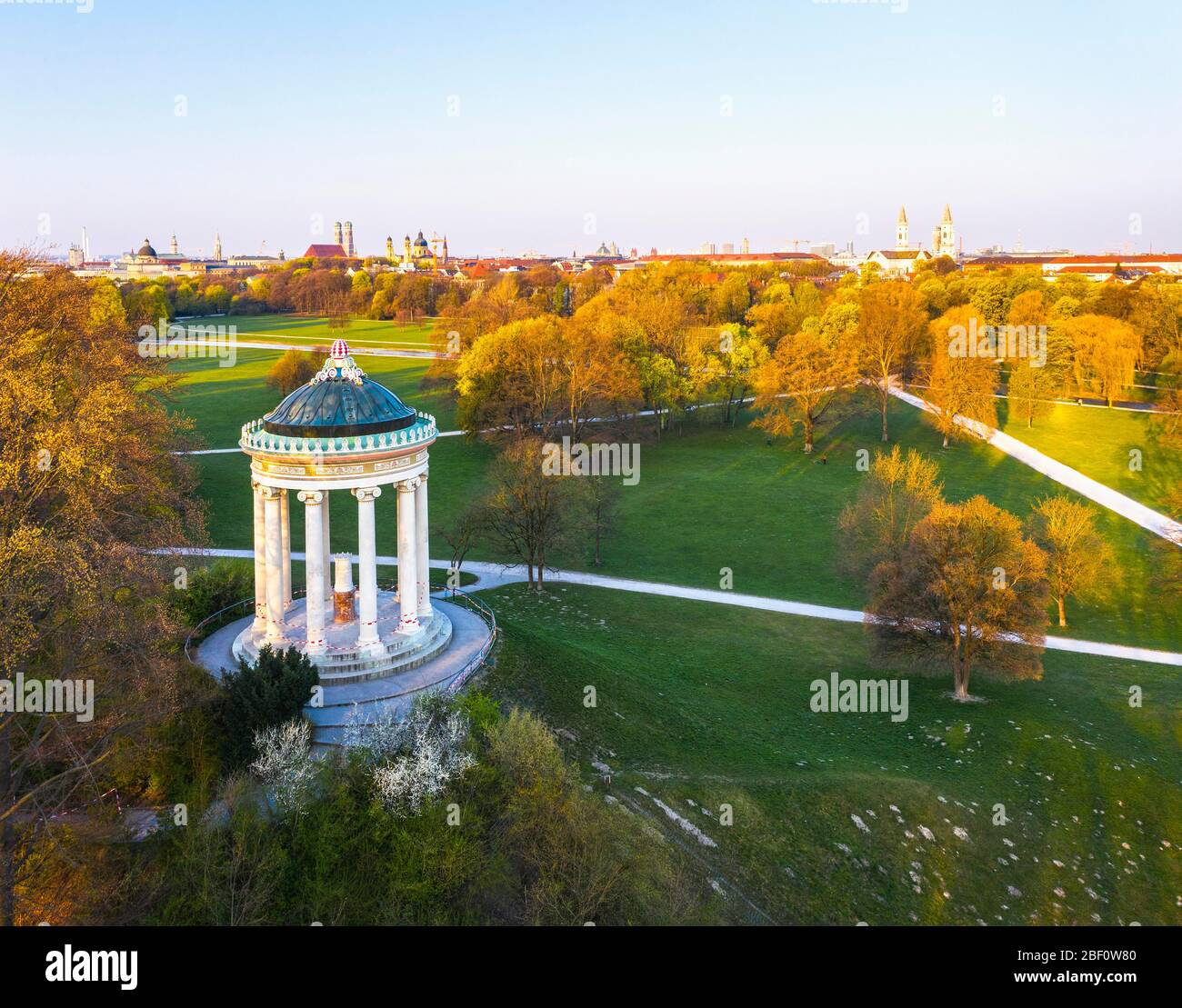 Monopteros with barrier tapes during curfew in the morning light, English Garden, View to the old town, Munich, Aerial view, Upper Bavaria, Bavaria Stock Photo