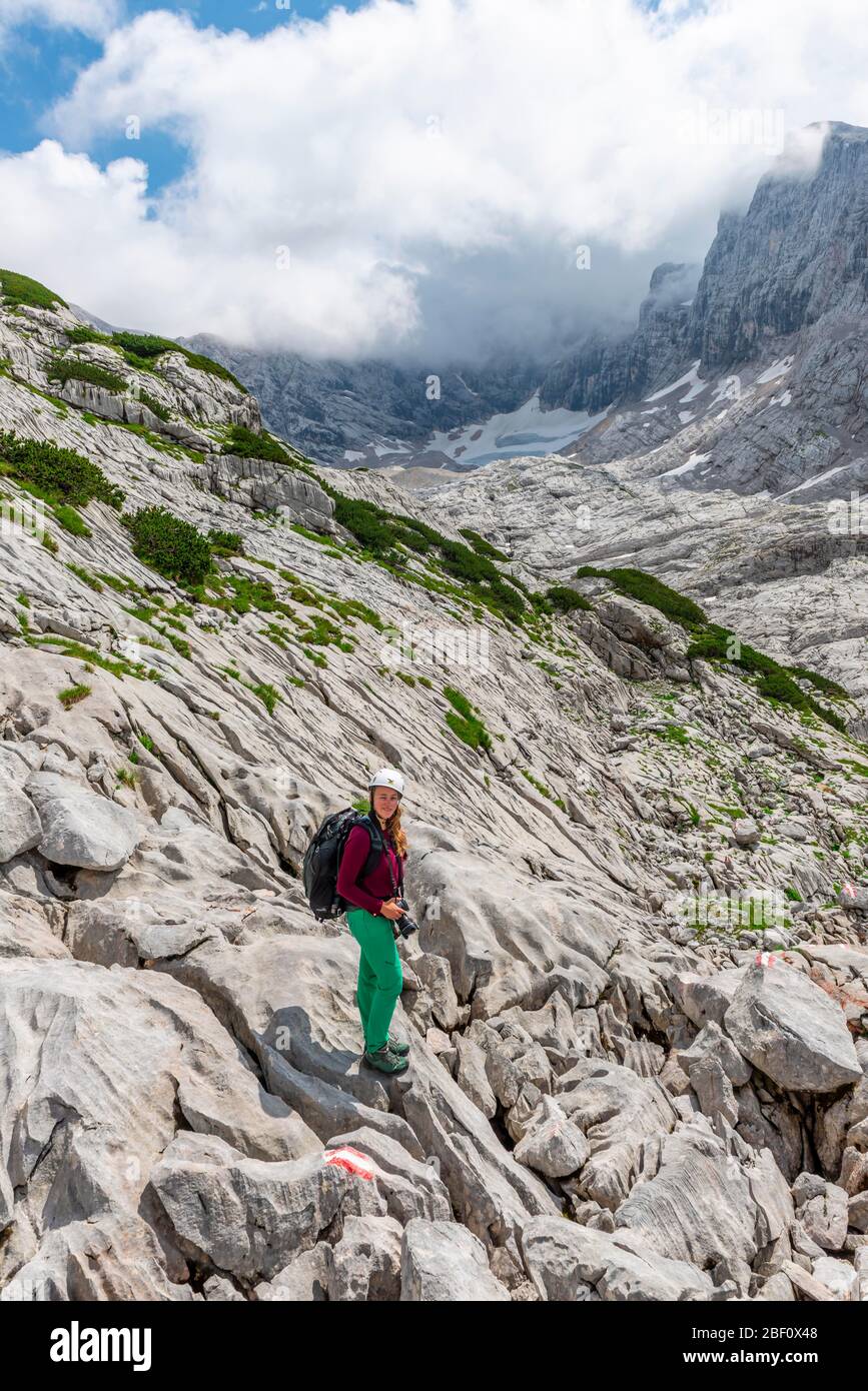 Mountaineer on marked route from Simonyhuette to Adamekhuette, rocky alpine terrain, Salzkammergut, Upper Austria, Austria Stock Photo