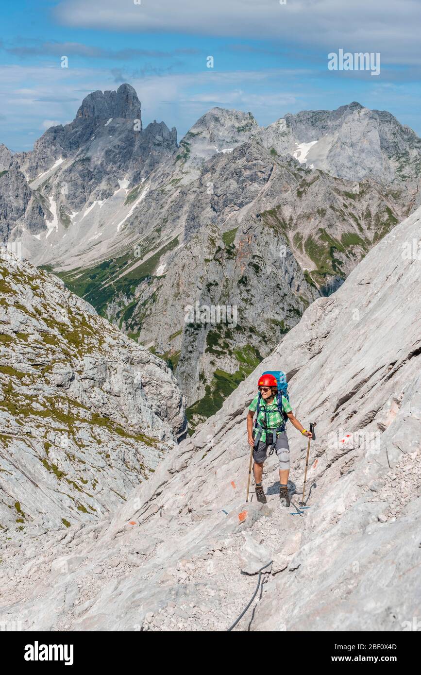 Mountaineer on marked route from Simonyhuette to Adamekhuette, rocky alpine terrain, Salzkammergut, Upper Austria, Austria Stock Photo