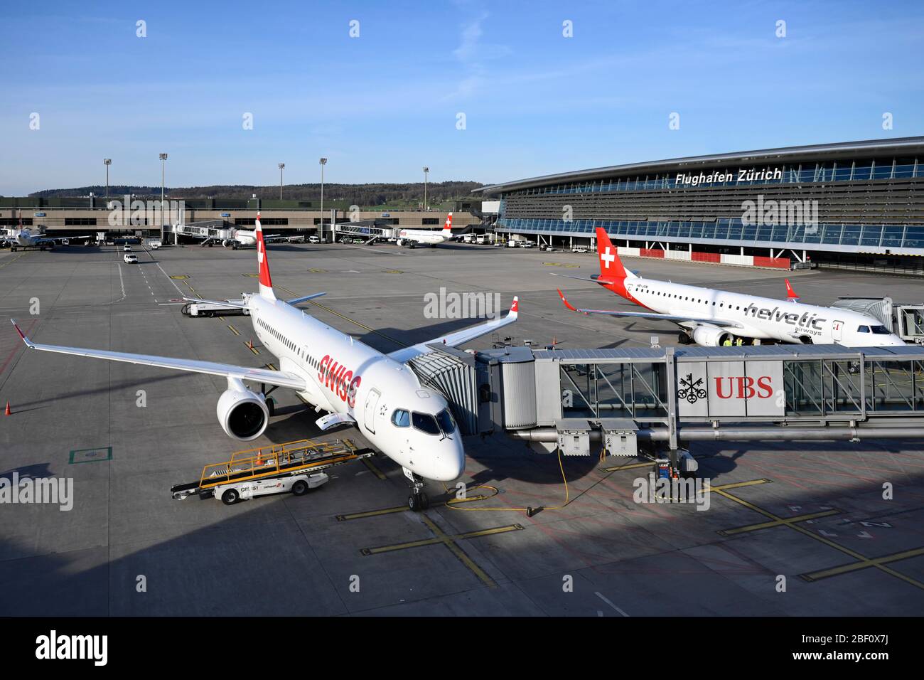 Zurich Airport with aircraft Swiss Airbus A220300 HBJCS and Helvetic Airways Embraer ERJ190