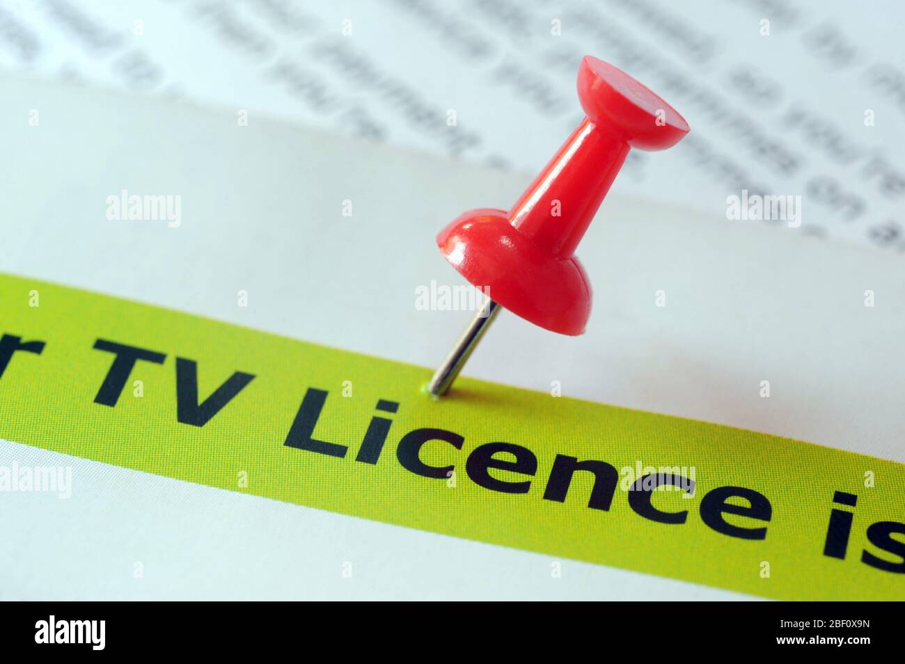 UK TV LICENCE LITERATURE WITH NOTICE BOARD PIN RE TELEVISION PROGRAM PAYMENT ELDERLY BBC PUBLIC MEDIA ETC UK Stock Photo