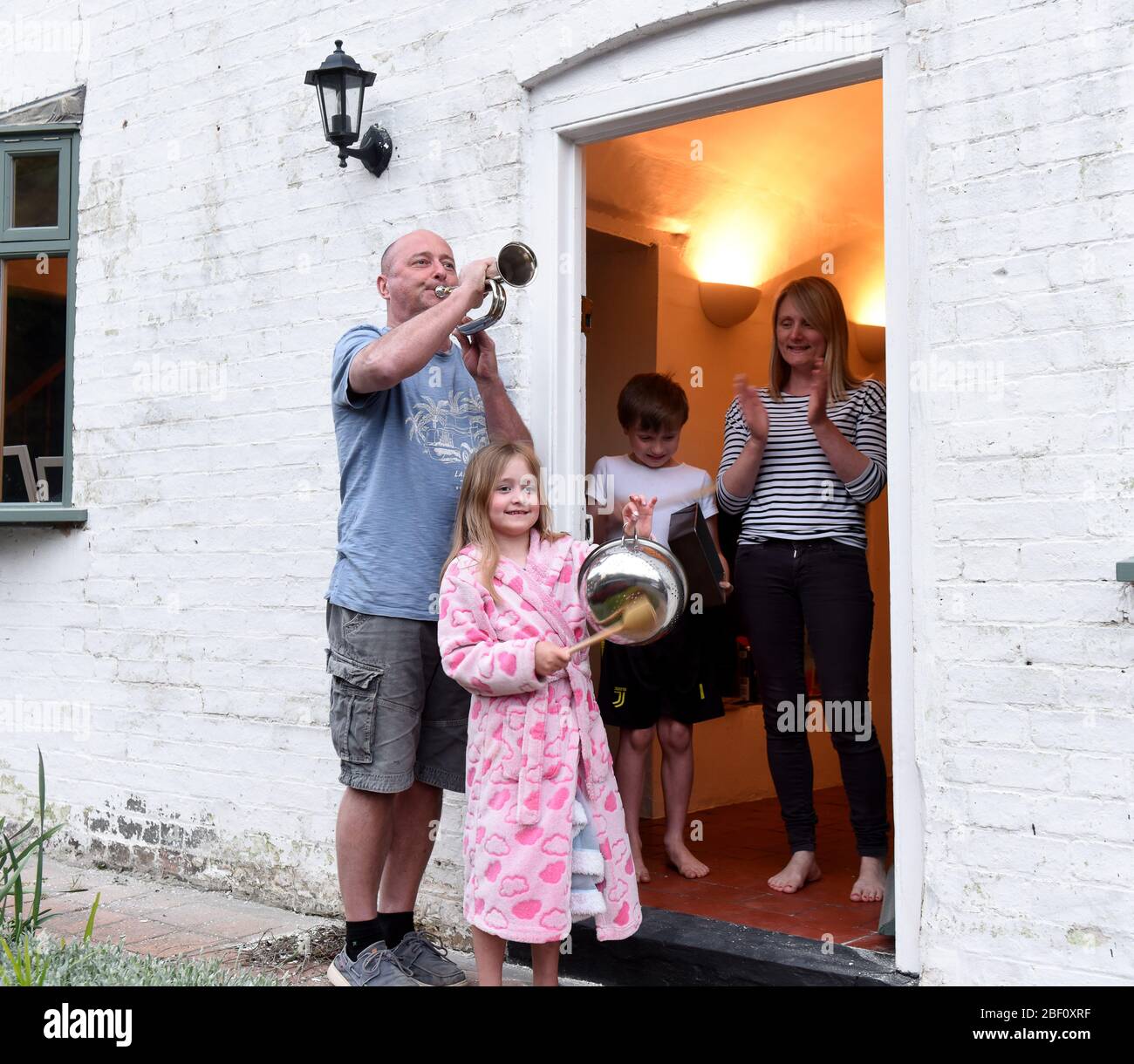 Ironbridge, Shropshire Uk 16th April 2020. The Severn Gorge was alive with music this evening as Joff Watkin added his bugle to the Thursday night natiowide support for the NHS and carers during the Coronavirus pandemic with a little help from his family. Credit: David Bagnall/Alamy Live News Stock Photo