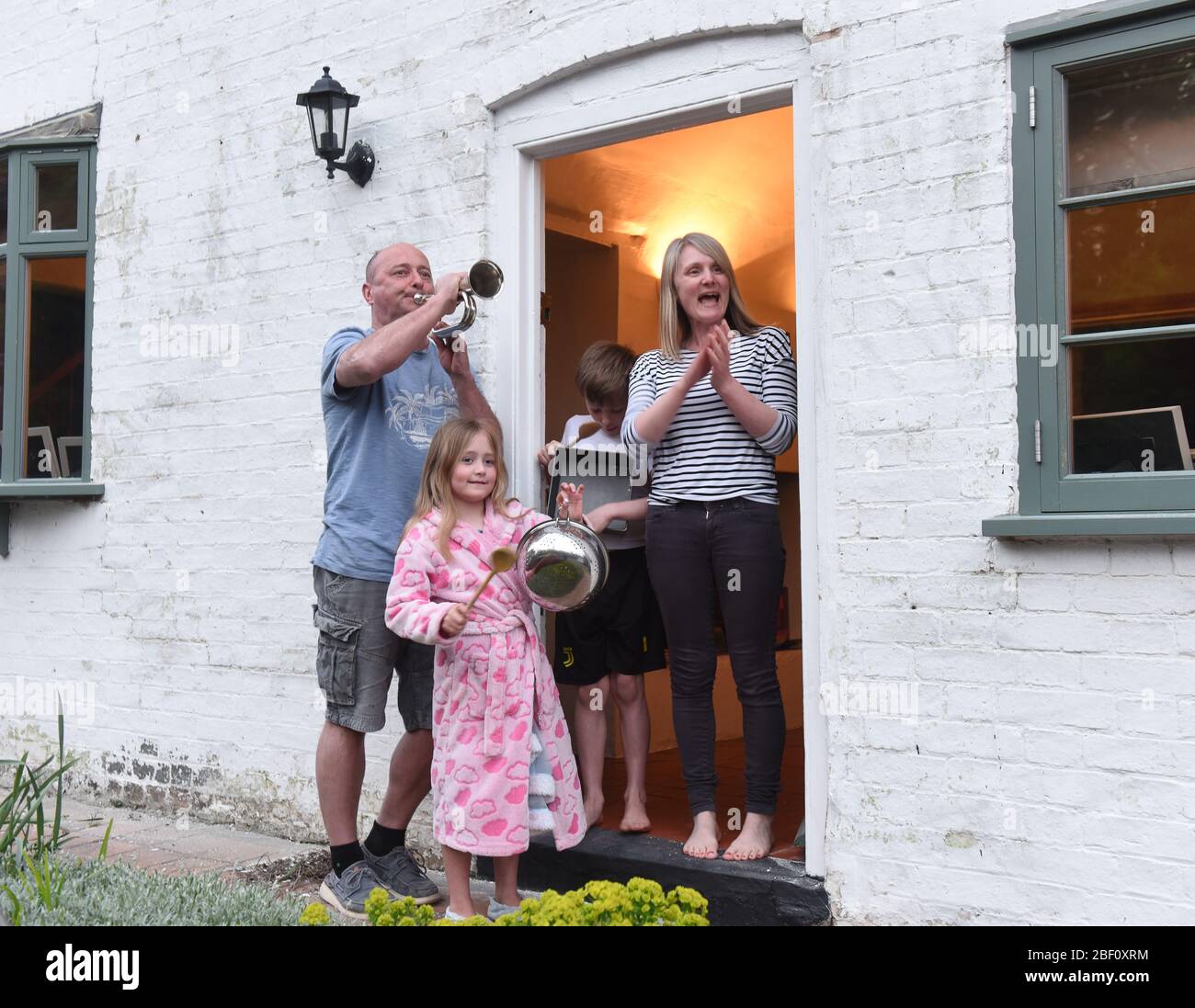 Ironbridge, Shropshire Uk 16th April 2020. The Severn Gorge was alive with music this evening as Joff Watkin added his bugle to the Thursday night natiowide support for the NHS and carers during the Coronavirus pandemic with a little help from his family. Credit: David Bagnall/Alamy Live News Stock Photo