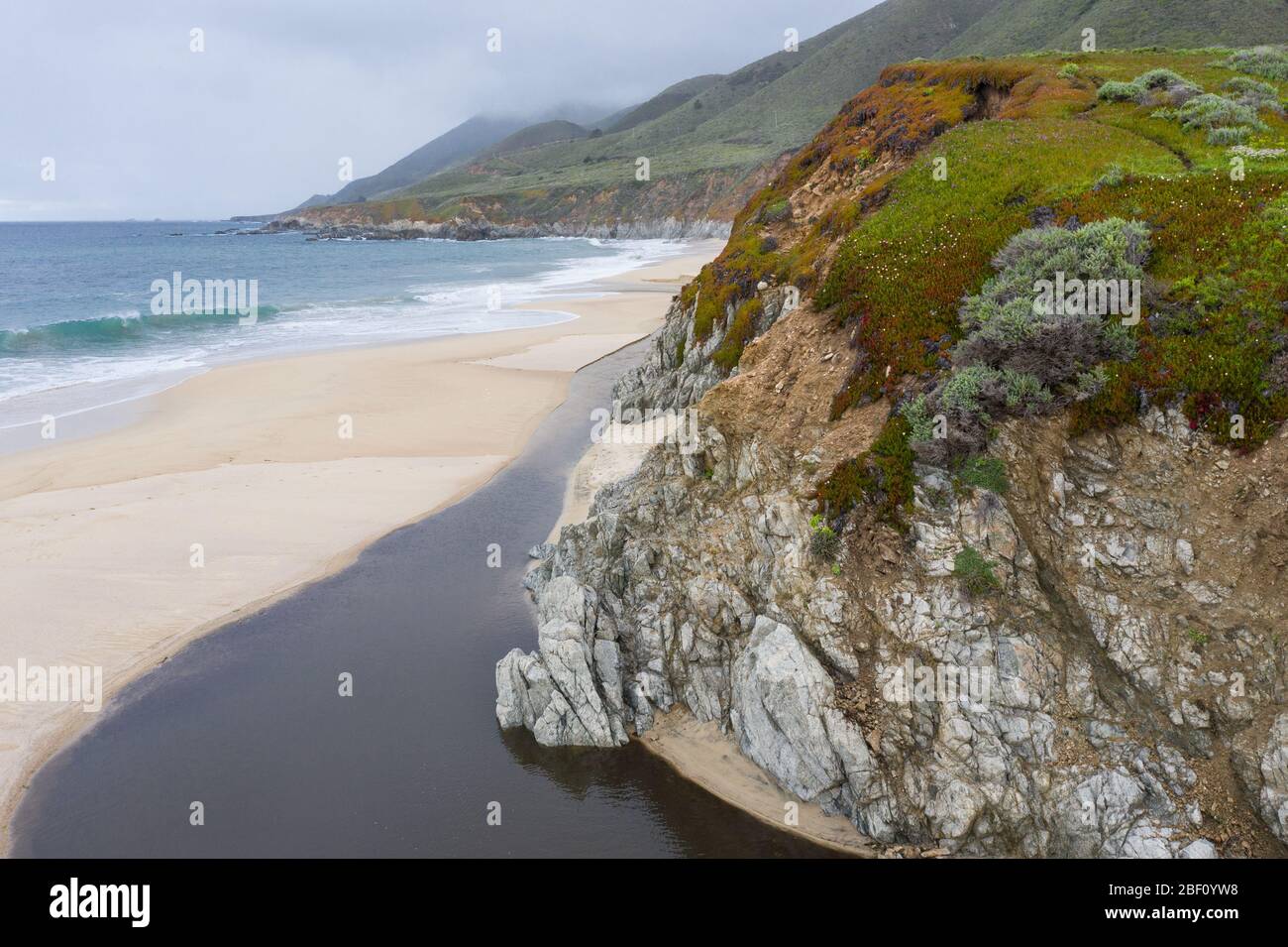 The Pacific Ocean washes against a scenic beach in Northern California. This part of the west coast is one of the most beautiful regions in America. Stock Photo