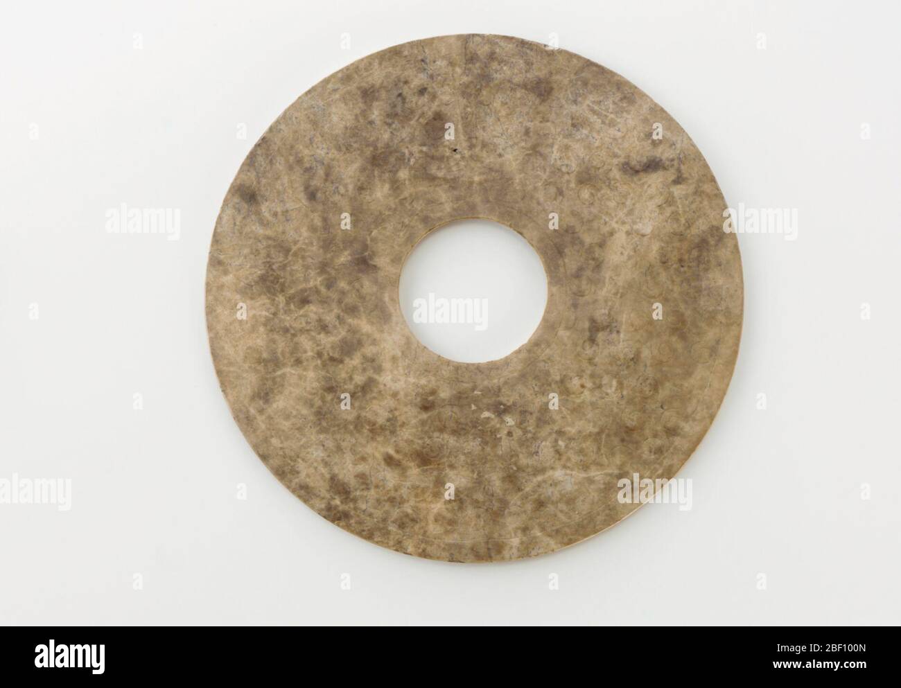; China; 475-221 B.C.E.; Jade (?); Diam x D: 14.4 x 0.4 cm (5 5/8 x 3/16 in); Gift of Charles Lang Freer Stock Photo
