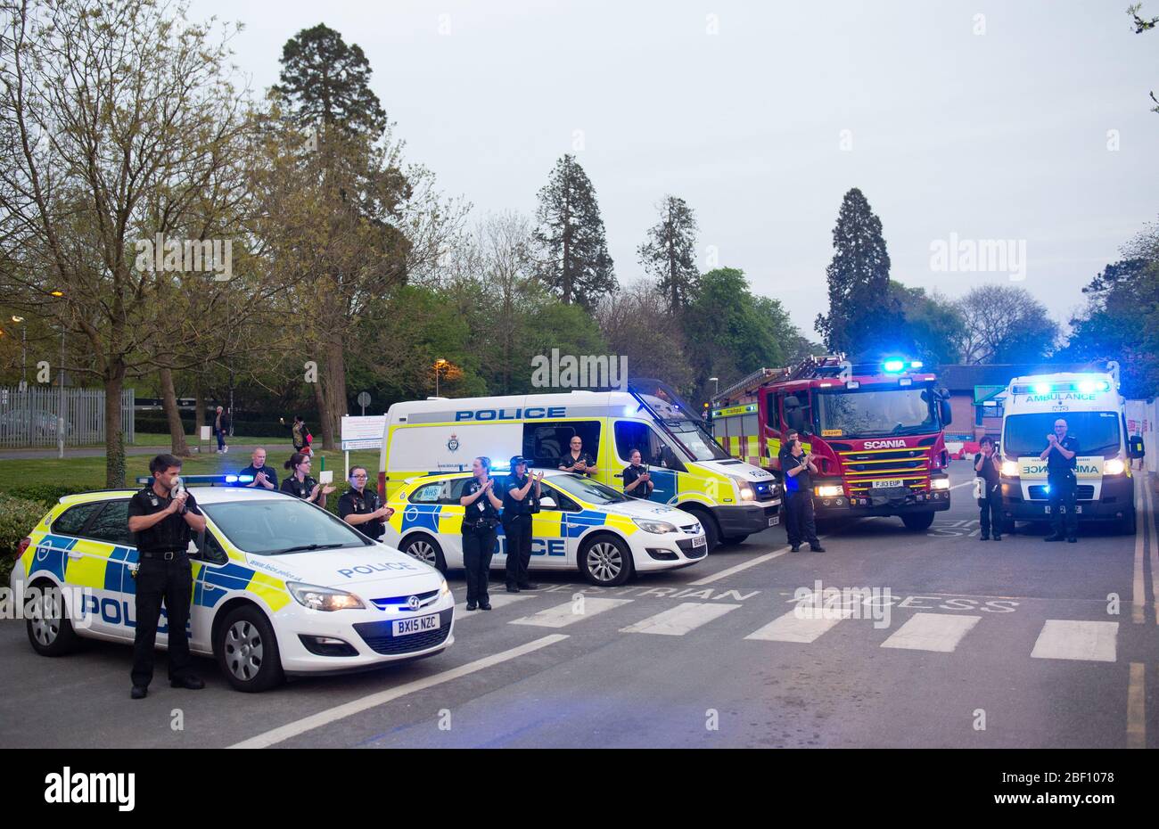Members of the police force, fire service and paramedics join the applause outside Glenfield Hospital in Leicester, to salute local heroes during Thursday's nationwide Clap for Carers NHS initiative to applaud NHS workers and carers fighting the coronavirus pandemic. Stock Photo