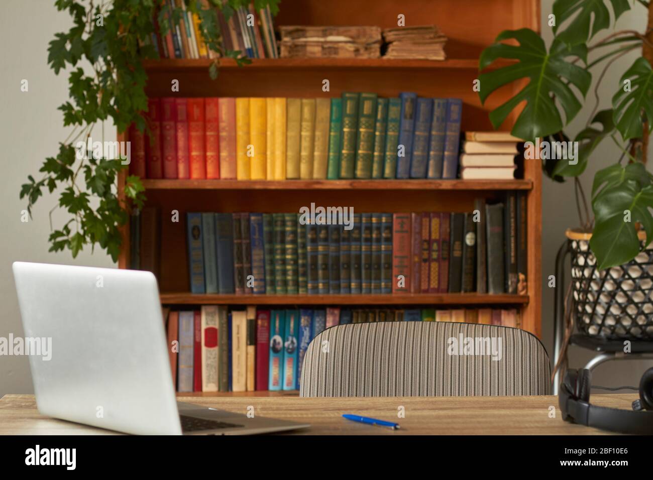 Workplace with notebook laptop in the home library, quarantined work ...