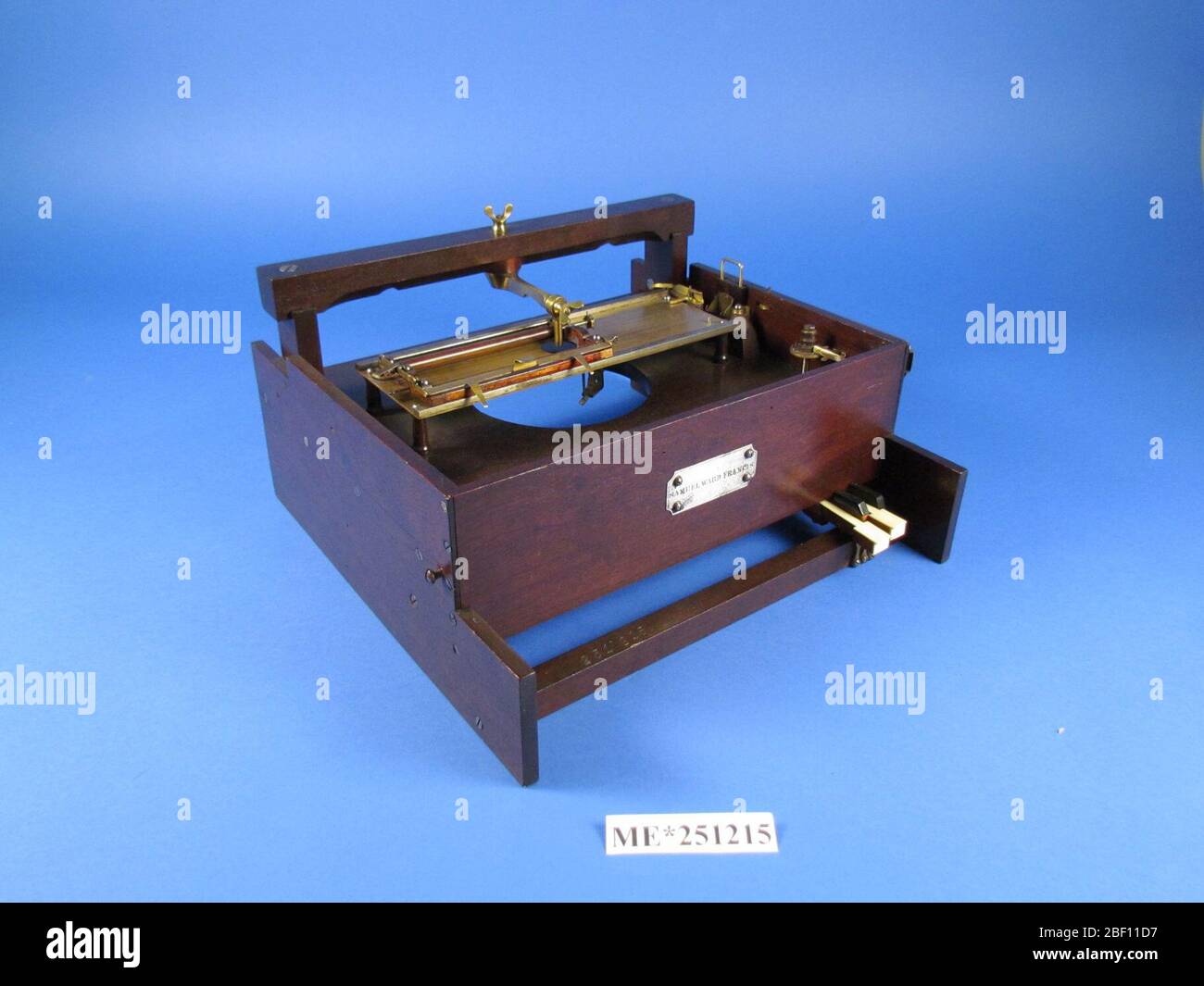 Samuel W Francis Typewriter Patent Model. Samuel Ward Francis of New York, New York received patent number 18,504 on October 27, 1857 for this printing-machine patent model. The model has a light wooden frame with four piano keys, and a metal platen carriage system. Stock Photo