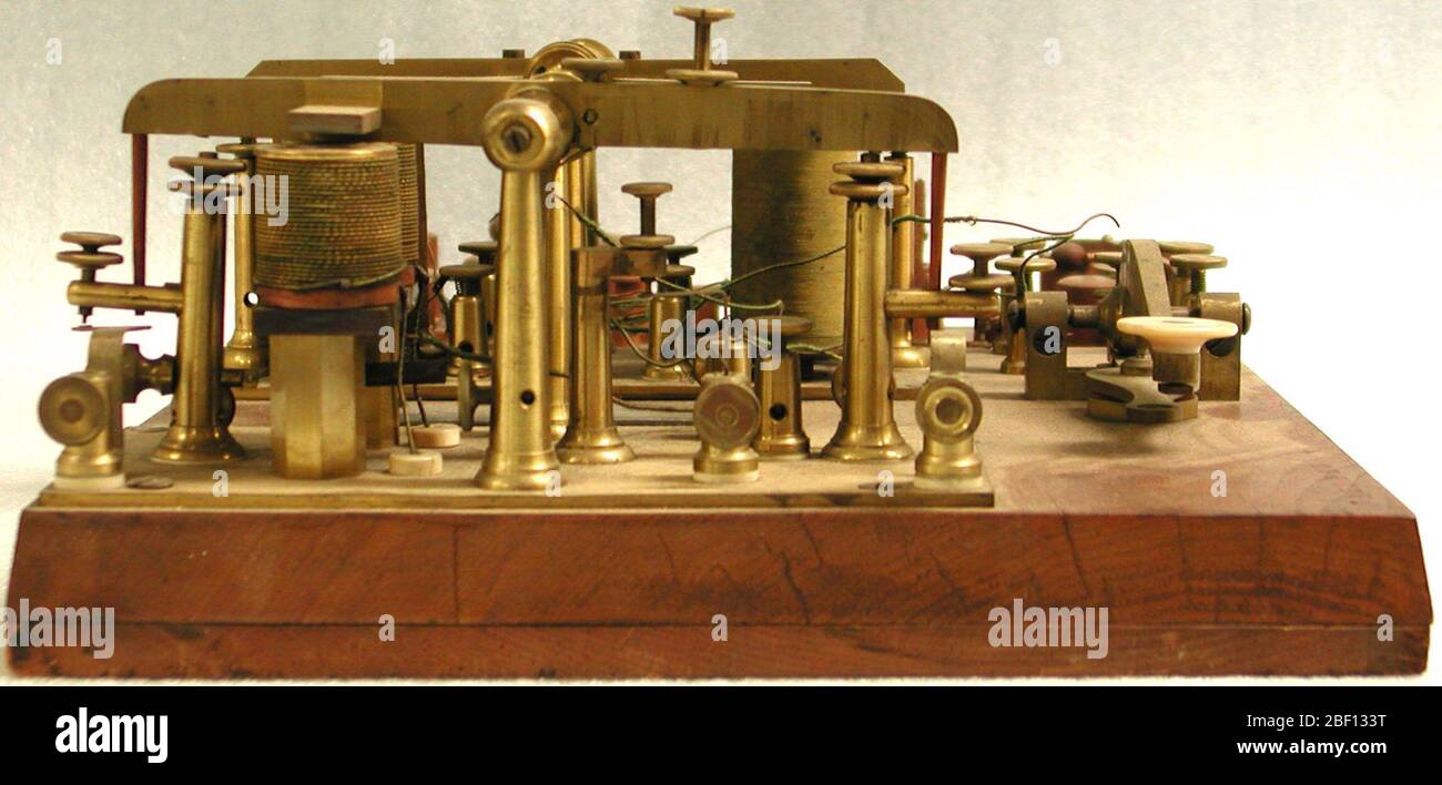 Smith telegraph repeater patent model. Telegraph repeaters amplified electrical signals in a telegraph line. Telegraph messages traveled as a series of electrical pulses through a wire from a transmitter to a receiver. Short pulses made a dot, slightly longer pulses a dash. Stock Photo