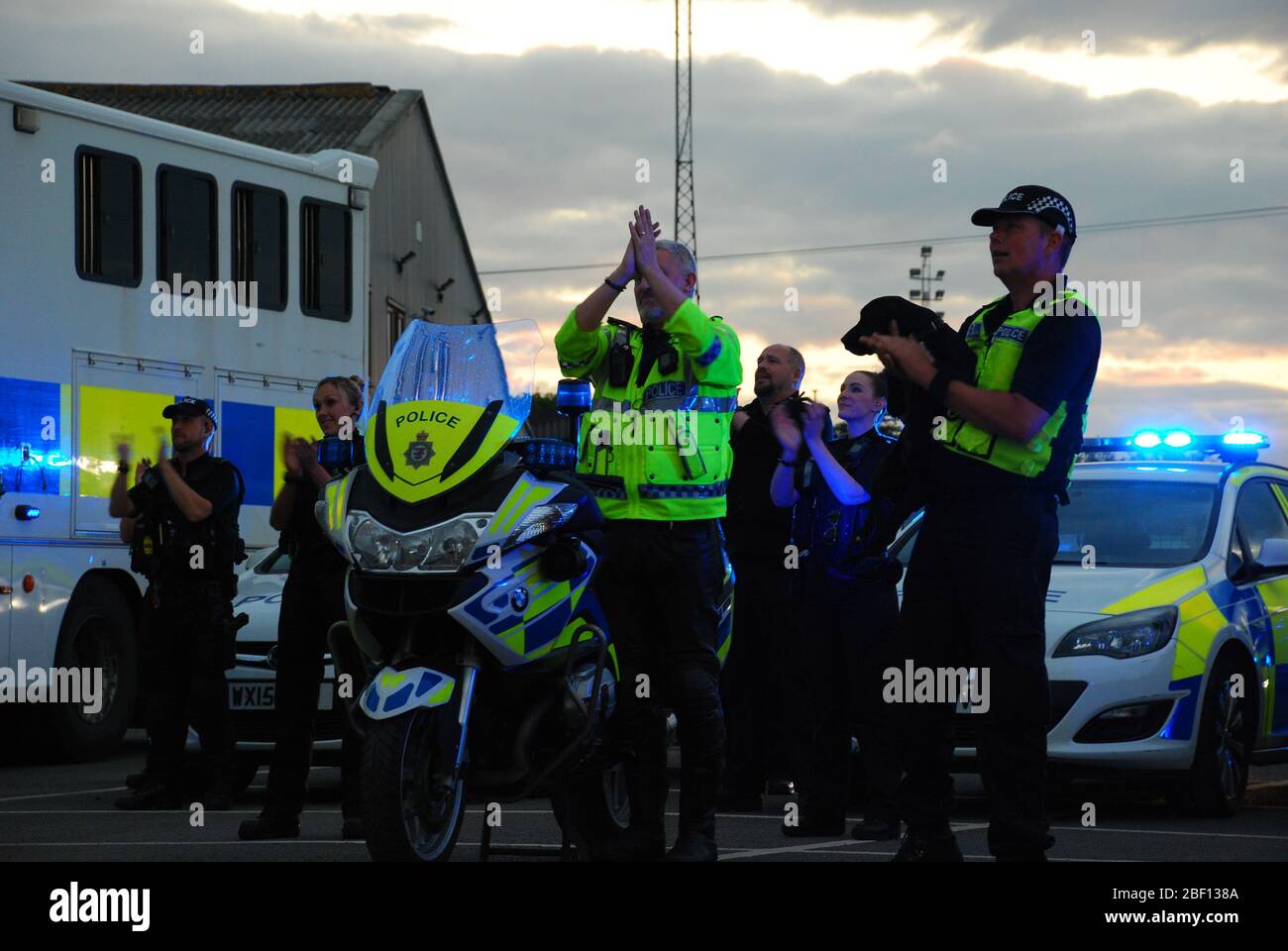 Traffic, firearms, patrol, mounted and dog units from Avon and Somerset Police join in the applause in Clevedon, Somerset, to salute local heroes during Thursday's nationwide Clap for Carers initiative to recognise and support NHS workers and carers fighting the coronavirus pandemic. Stock Photo