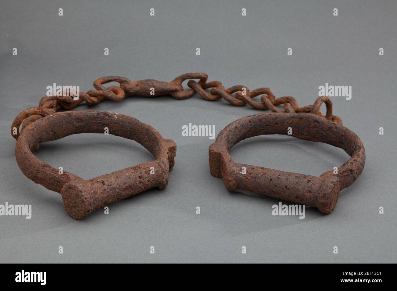 Shackles. Two iron shackles consisting of iron loops joined together by