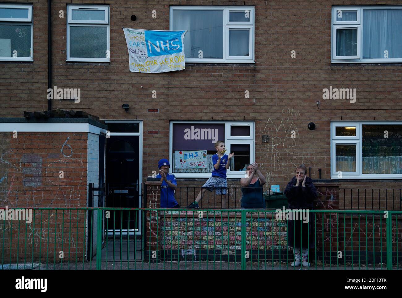 Loughborough, Leicestershire, UK. 16th April 2020. Residents applaud to show their appreciation for NHS workers in the fourth Clap for Carers event during the coronavirus pandemic lockdown. Credit Darren Staples/Alamy Live News. Stock Photo