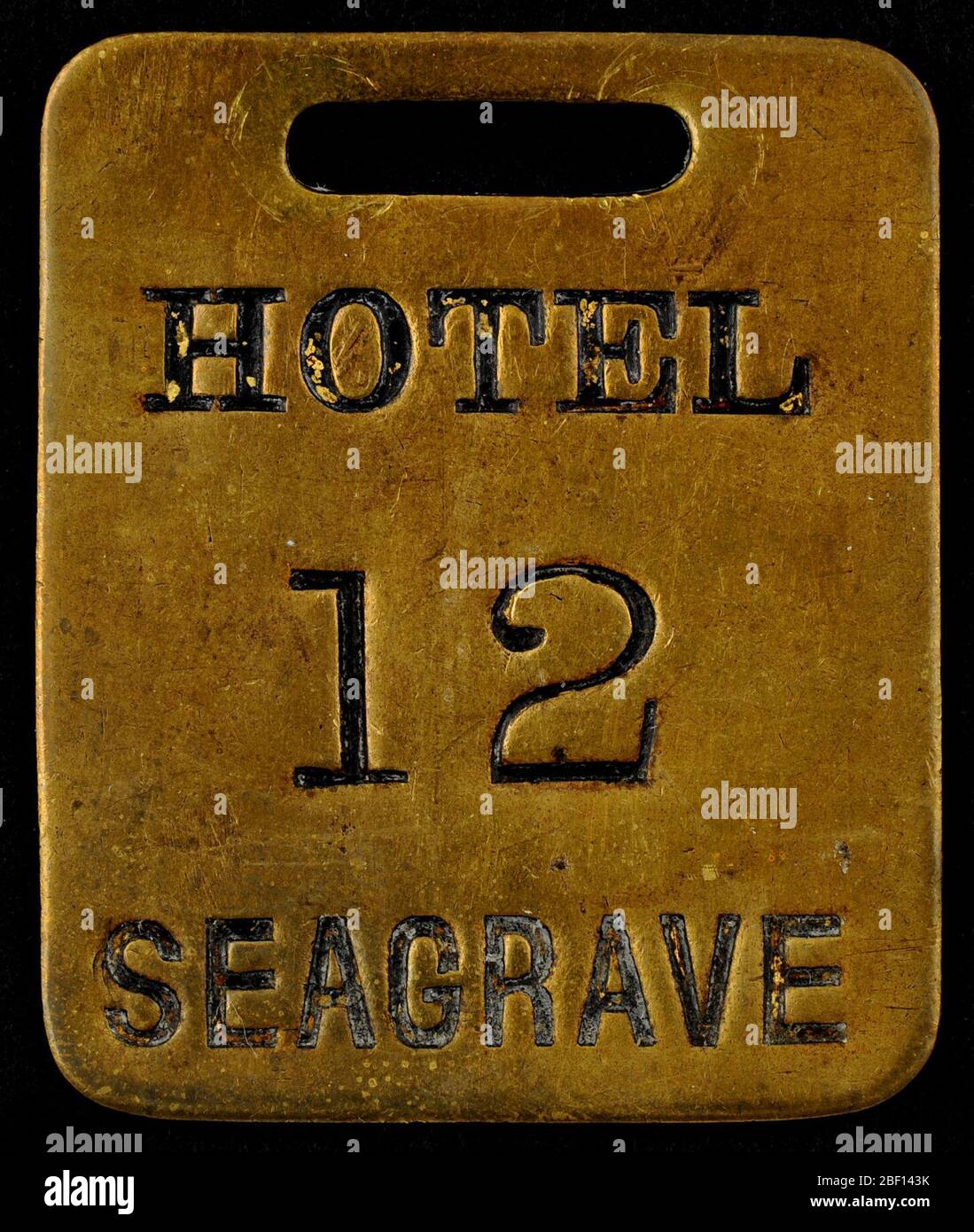 Hotel Seagrave Owney tag. Owney probably received this hotel key check token from Arthur A. Seagrave or one of his employees. Sometime in 1889-1890, Seagrave built a hotel on the corner of Virginia and 3rd Avenue in Seattle, Washington, naming it after himself. Stock Photo