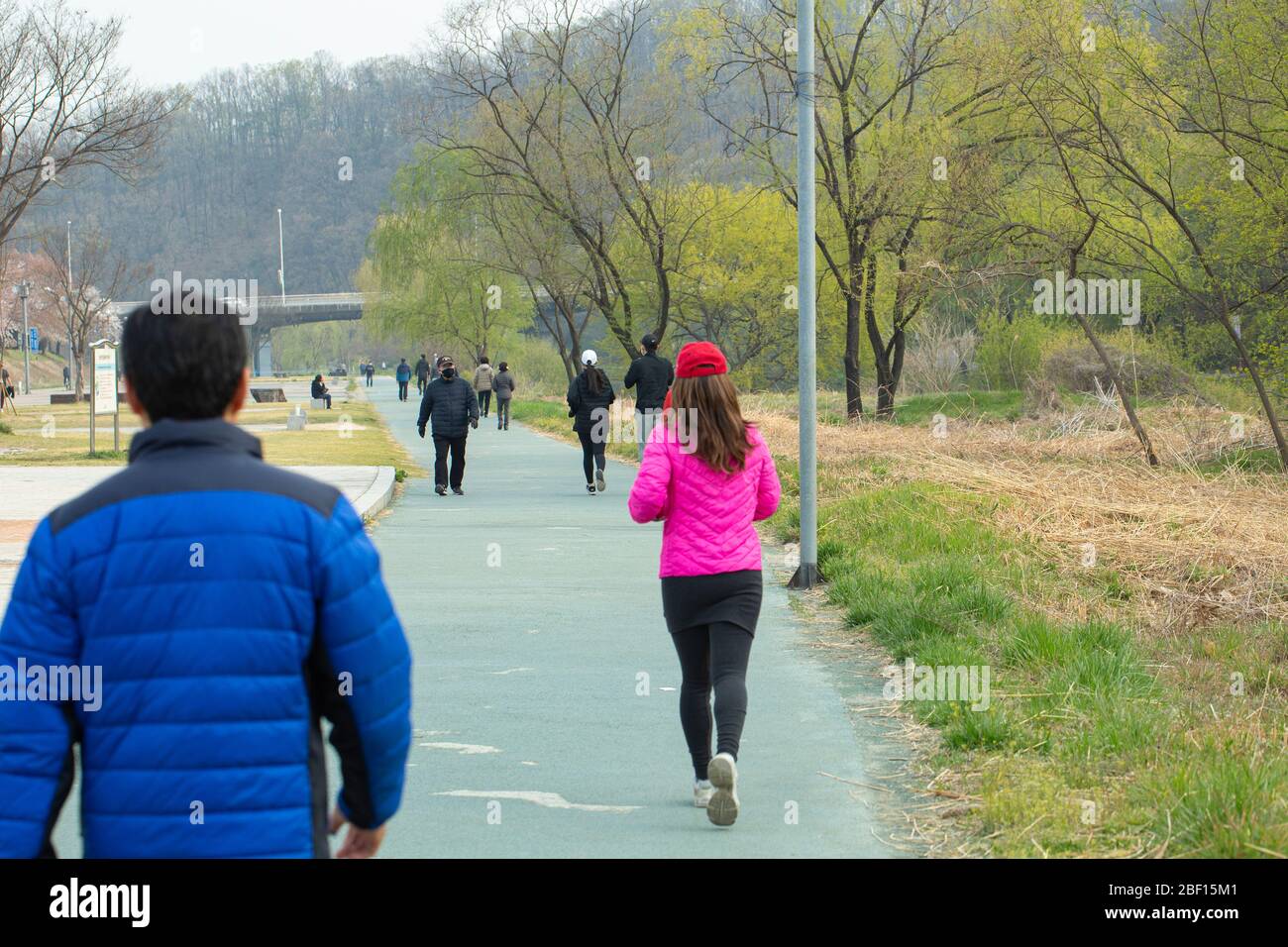 people are enjoying a walk in Tancheon riverside in spring, Seongnam-si, Korea- 11 Apr 2020 Stock Photo