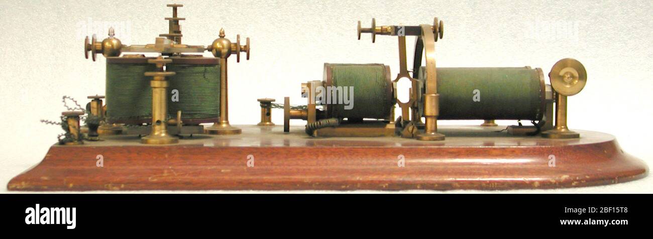 Hicks telegraph repeater patent model. Telegraph repeaters amplified electrical signals in a telegraph line. Telegraph messages traveled as a series of electrical pulses through a wire from a transmitter to a receiver. Short pulses made a dot, slightly longer pulses a dash. Stock Photo