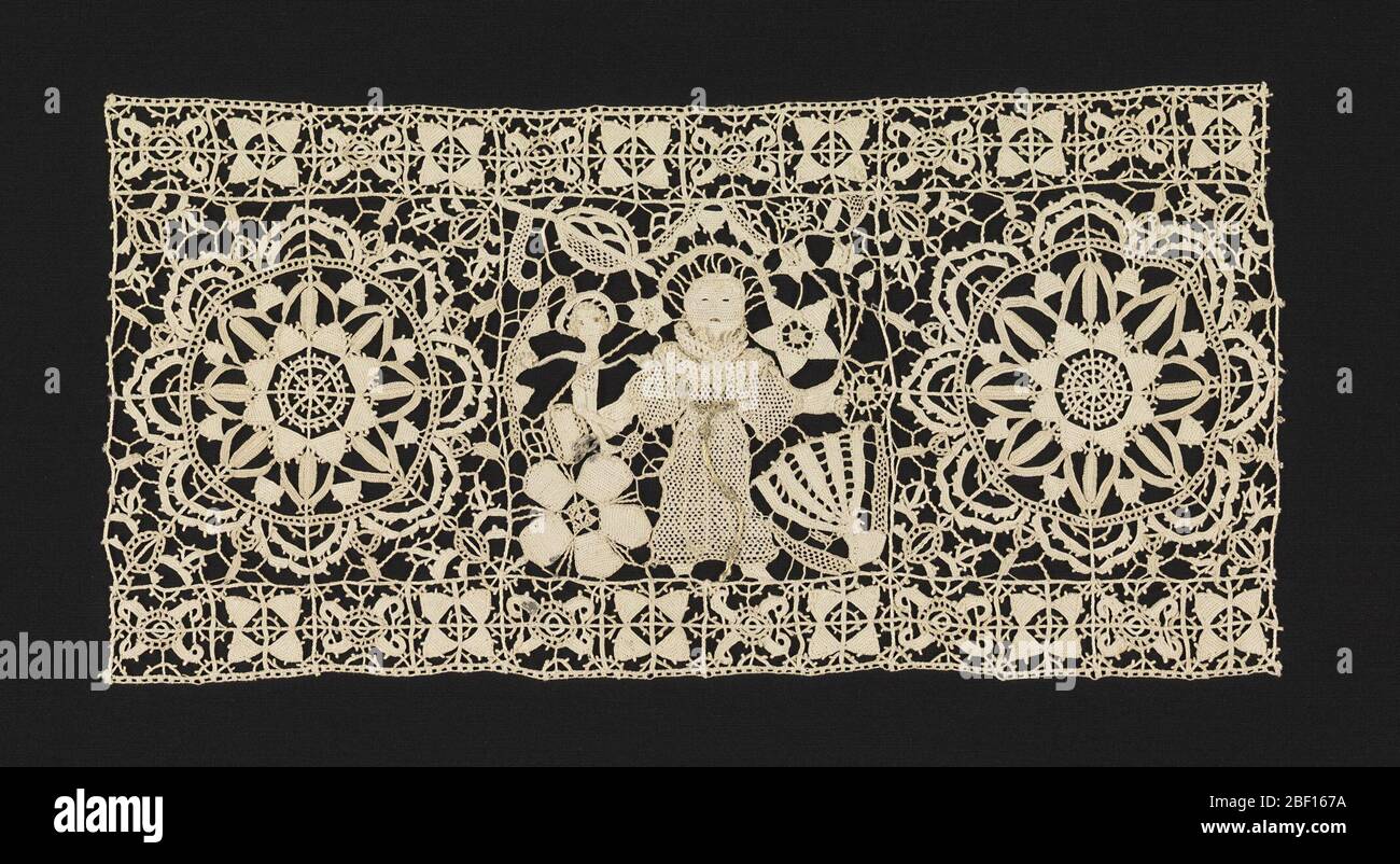 Border. Fragment of a deep lace border with figures of St. Anthony and the Christ Child, flanked by large geometric rosettes, interspersed with floral and foliated forms. Upper and lower borders have geometric motifs in an alternating pattern. Stock Photo