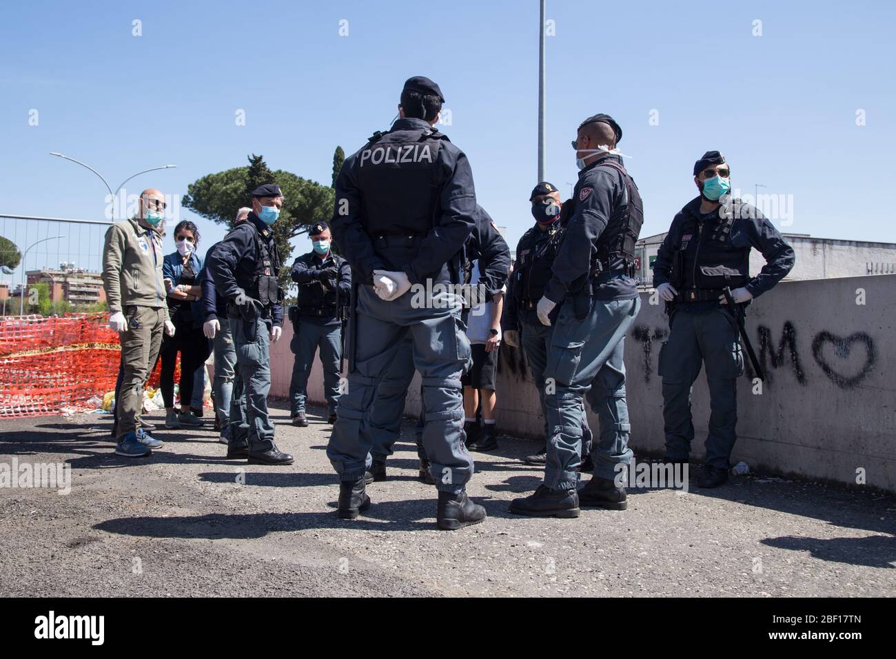 Rome, Italy. 16th Apr, 2020. Demonstration in front of the entrance of the Rebibbia prison in Rome, Italy on April 16, 2020. Organized by a dozen family members and relatives of the detainees, to protest against the conditions of overcrowding of prisoners in Italian prisons, where many detainees and custodial agents are getting sick of Covid-19. At the end of the protest, the detainees' family members were taken away by the police. (Photo by Matteo Nardone/Pacific Press/Sipa USA) Credit: Sipa USA/Alamy Live News Stock Photo