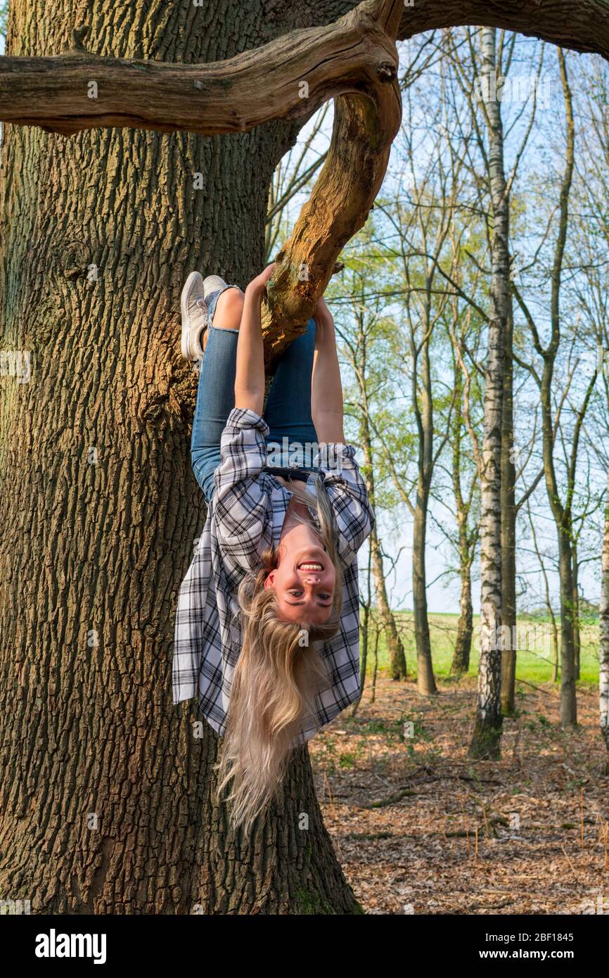 Woman hanging upside down from hi-res stock photography and images - Alamy