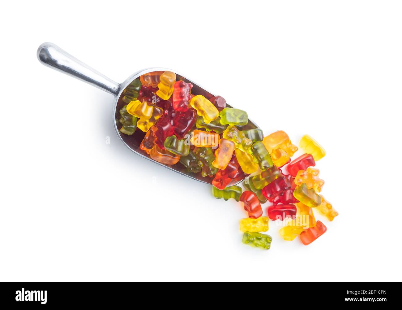 Gummy bears, jelly candy. Colorful bonbons in scoop isolated on white