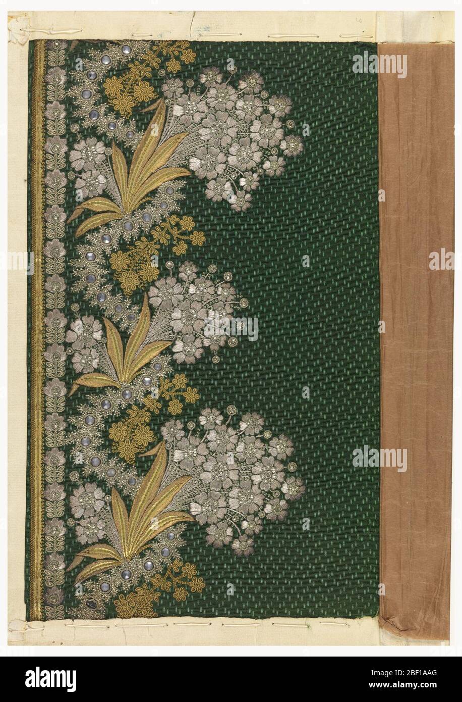 Embroidery sample. Floral design embroidered with silver and gold thread,  sequins and wire, and bits of glass on a patterned green ground Stock Photo  - Alamy