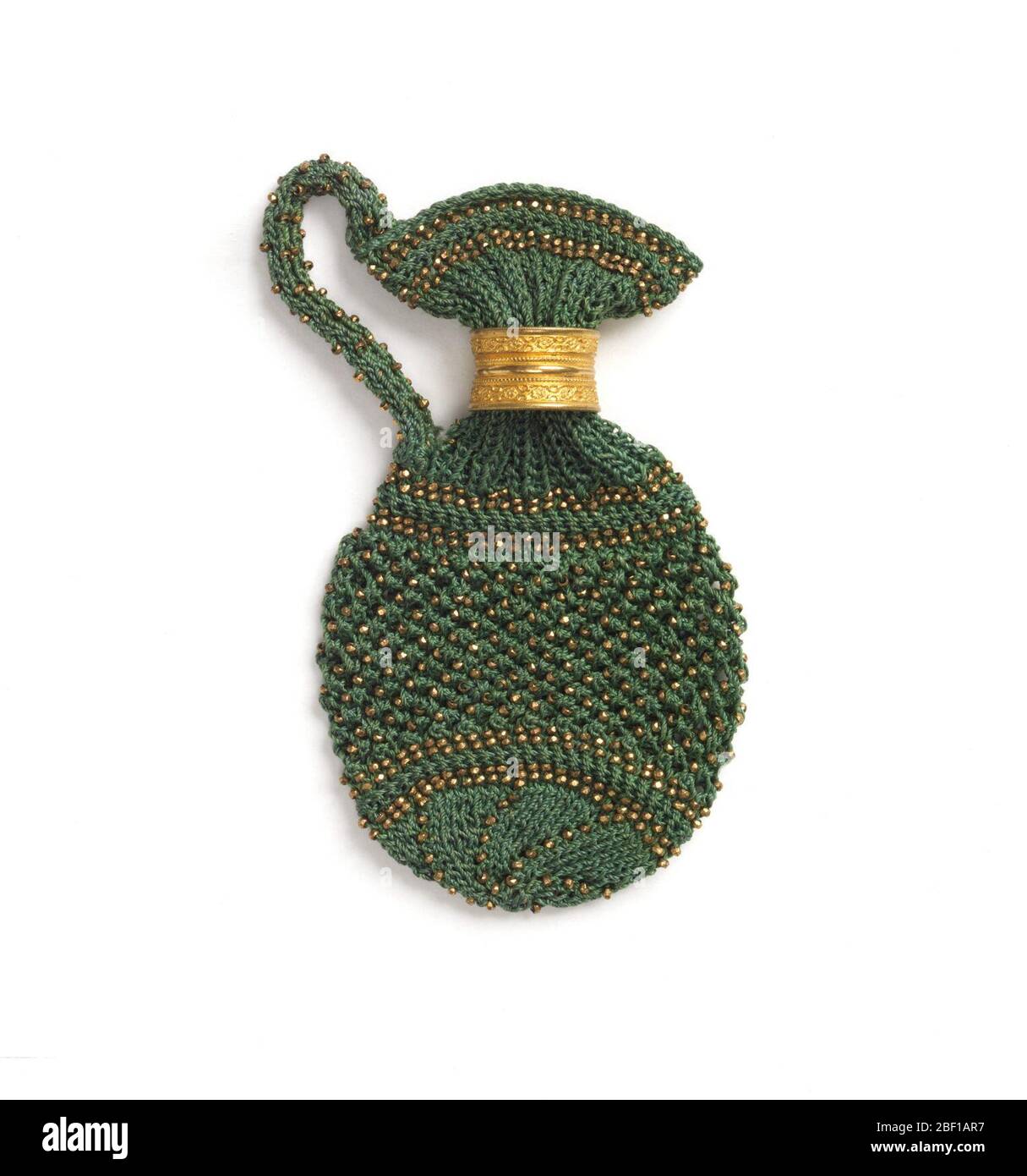 Purse pence jug. Knitted purse in the shape of a jug and ornamented with copper-colored beads. Stock Photo