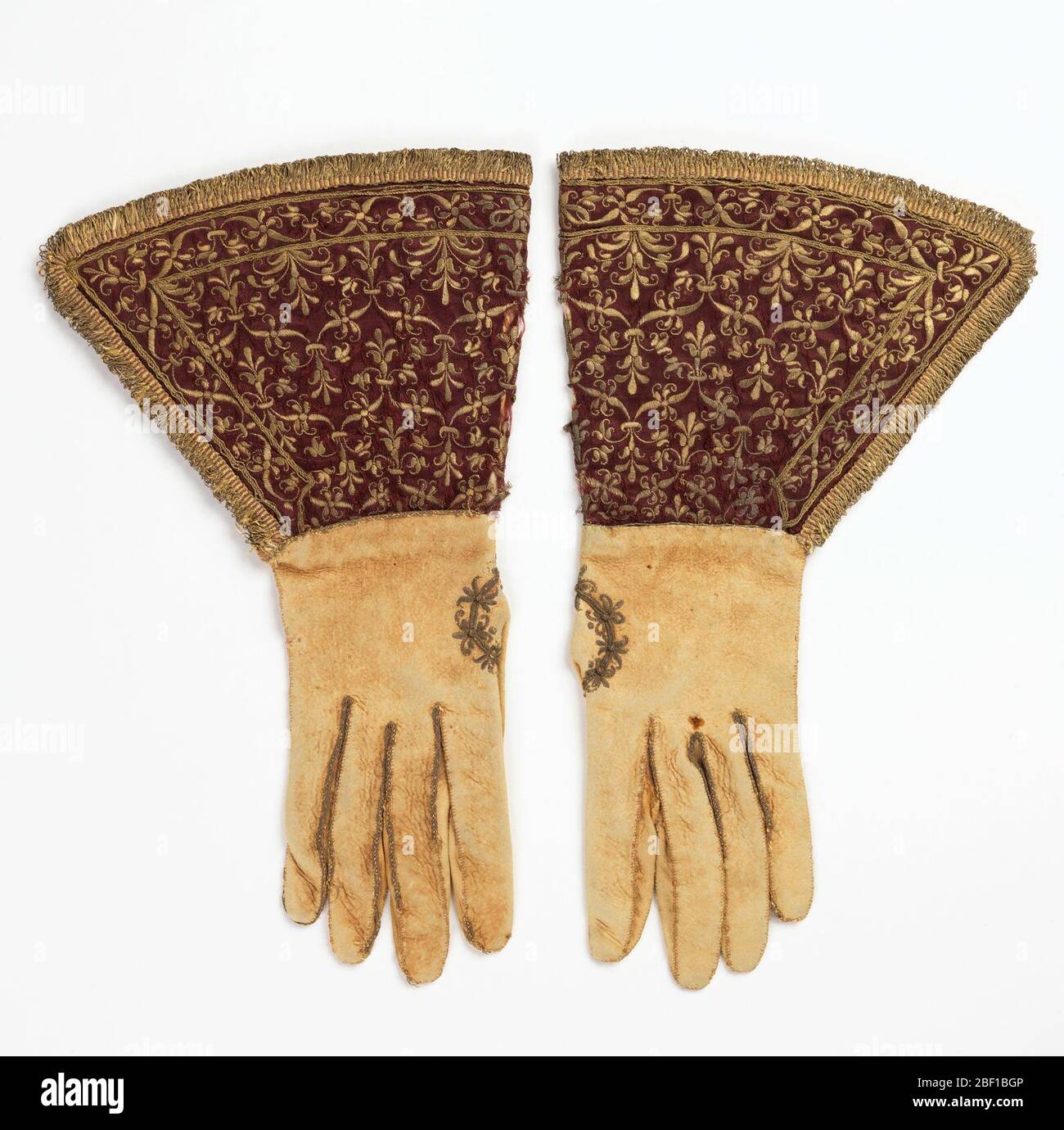 Gloves. Pair of white leather gloves with deep gauntlets of dark 