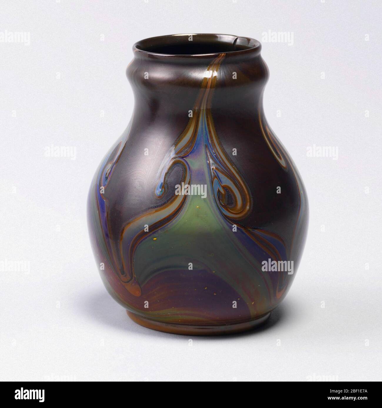 Vase. Pearshaped body of brownish opaque glass with convex band below