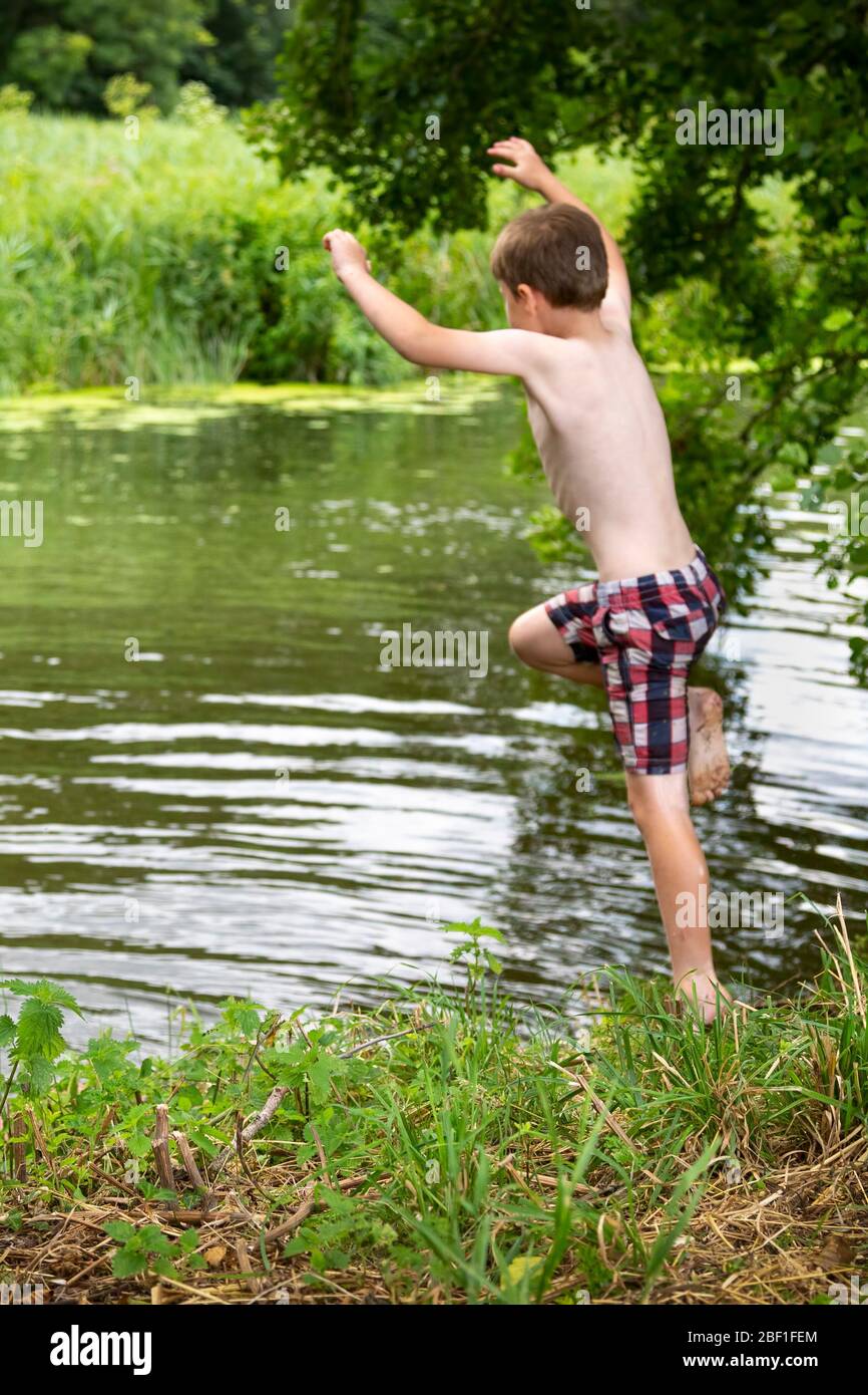 Boy Jumping Into A River High Resolution Stock Photography and Images ...