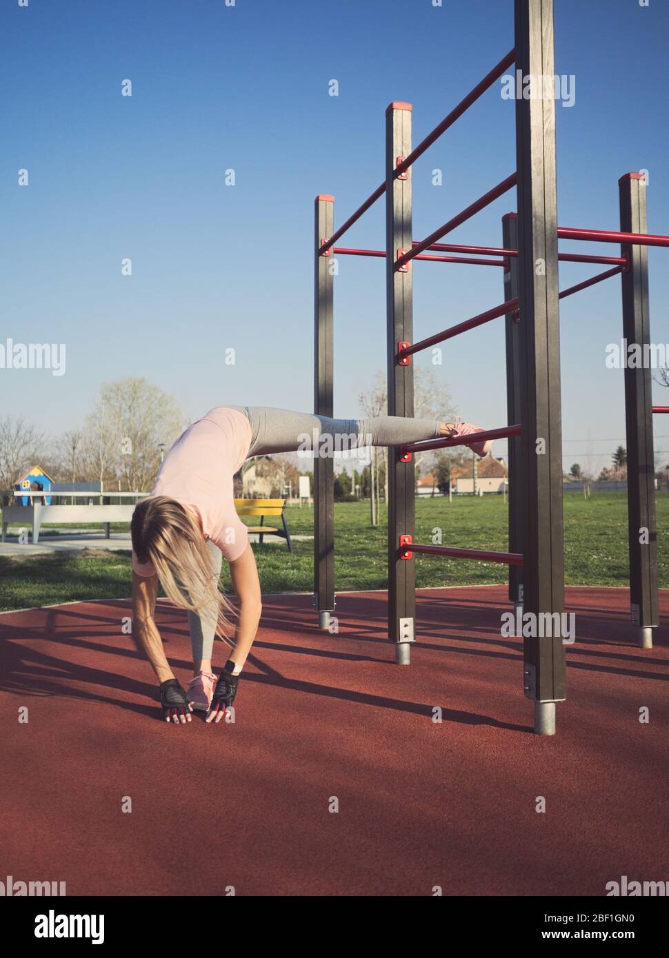Athletic woman stretching legs hi-res stock photography and images - Alamy