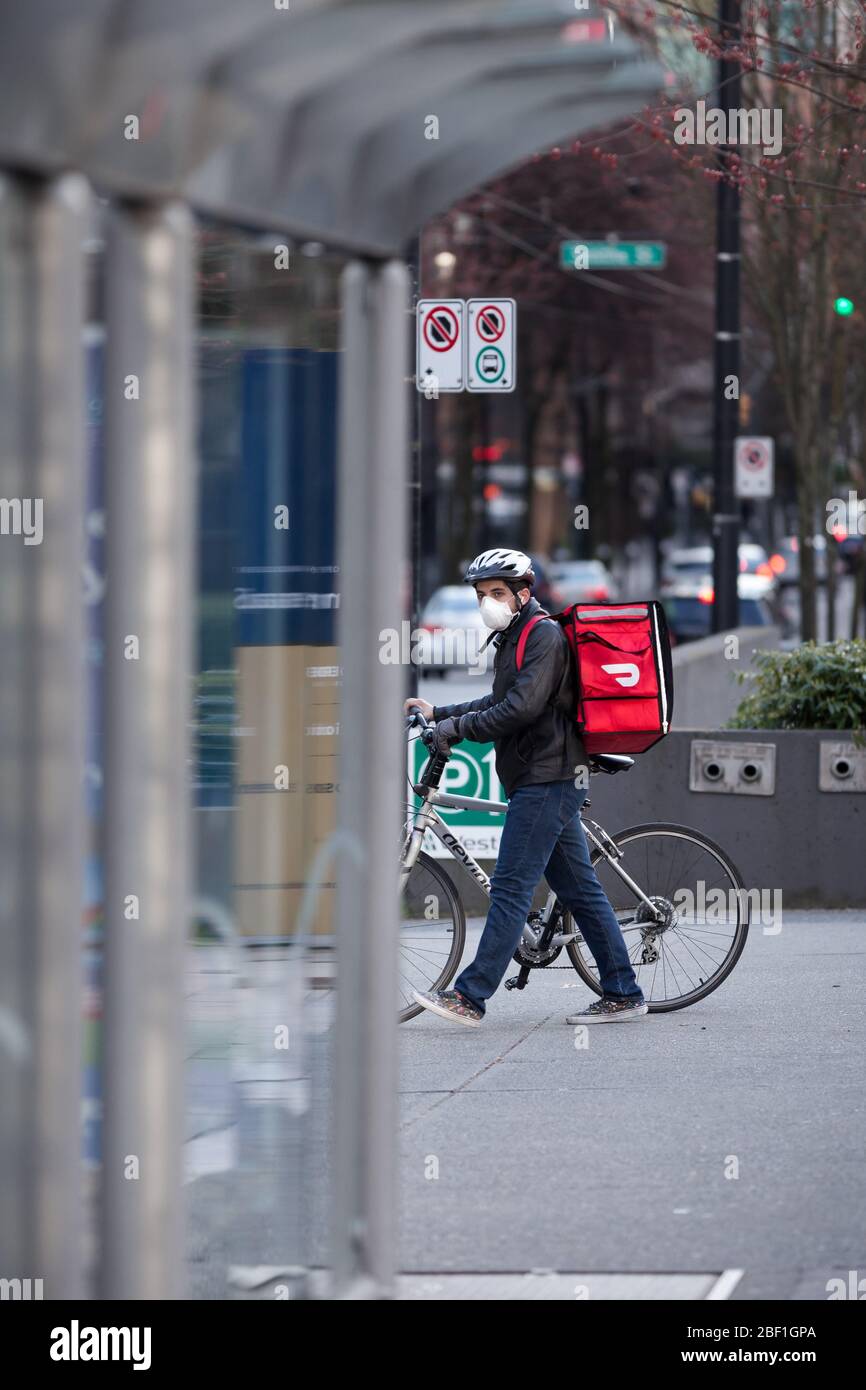 DOWNTOWN VANCOUVER, BC, CANADA APR 01, 2020 A DoorDash food delivery