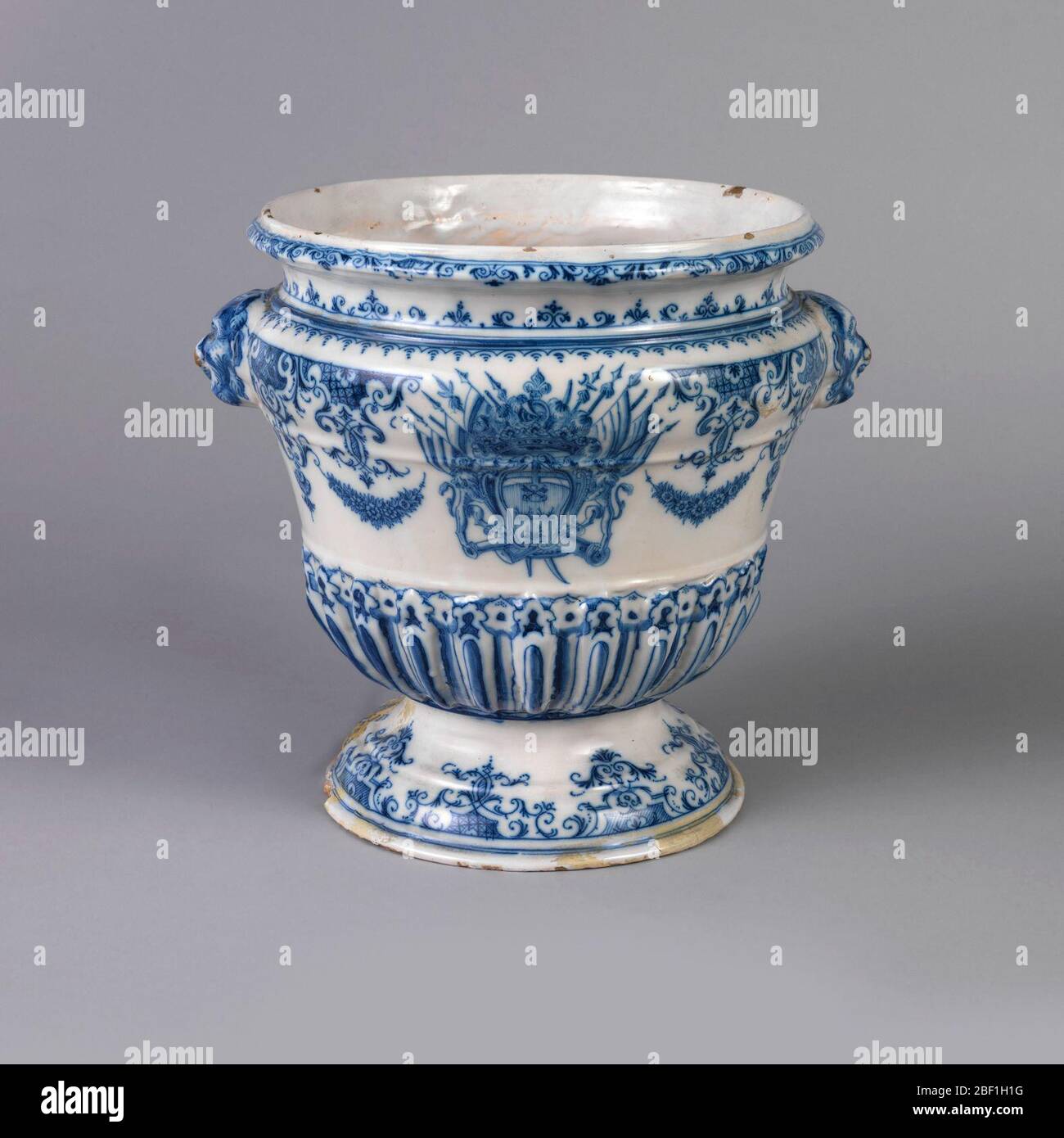 Urn. On molded foot a bell-shaped body with heavy gadrooning on lower ...