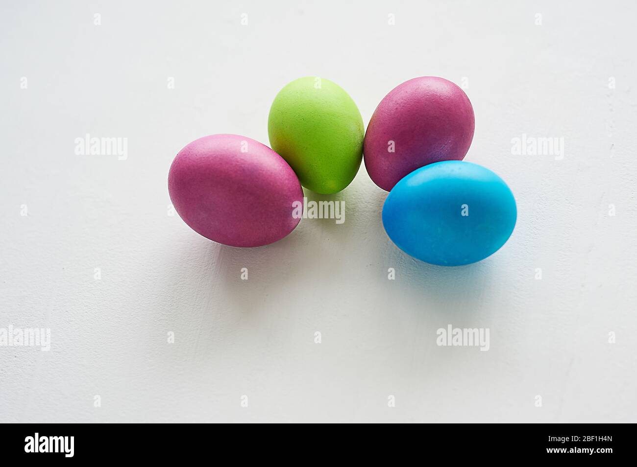 Painted multicolored eggs against a light background. Diet, protein, protein.Preparing for Easter. Stock Photo