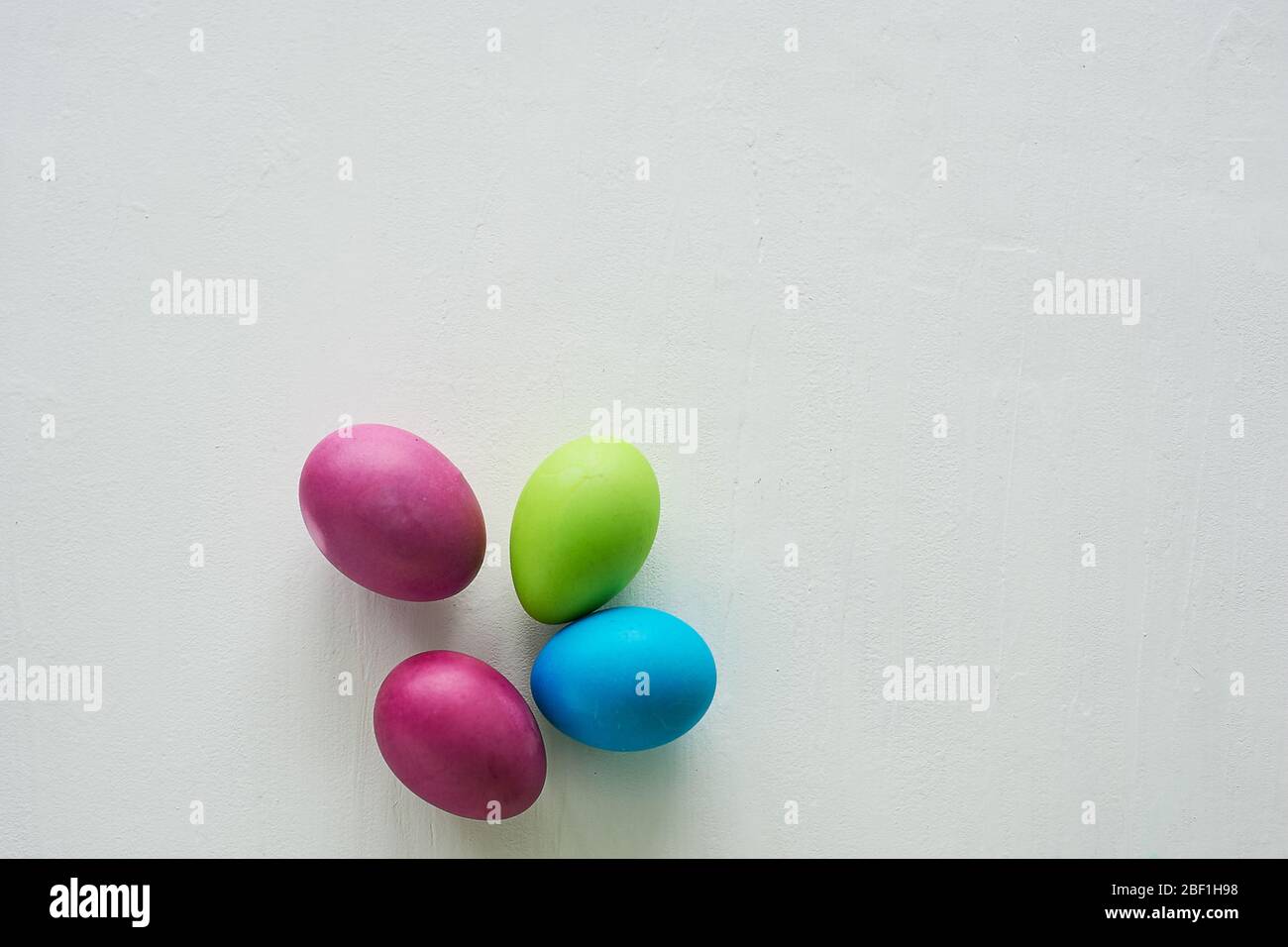 Painted multicolored eggs against a light background.Diet, protein, protein. Preparing for Easter. Stock Photo