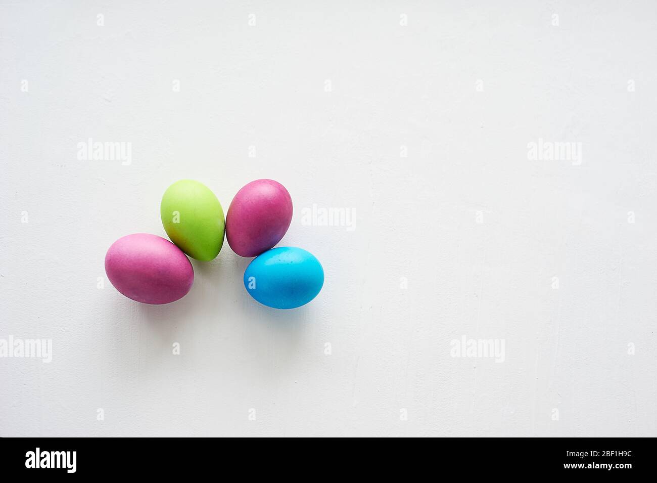 Painted multicolored eggs against a light background. Diet, protein, protein.Preparing for Easter. Stock Photo
