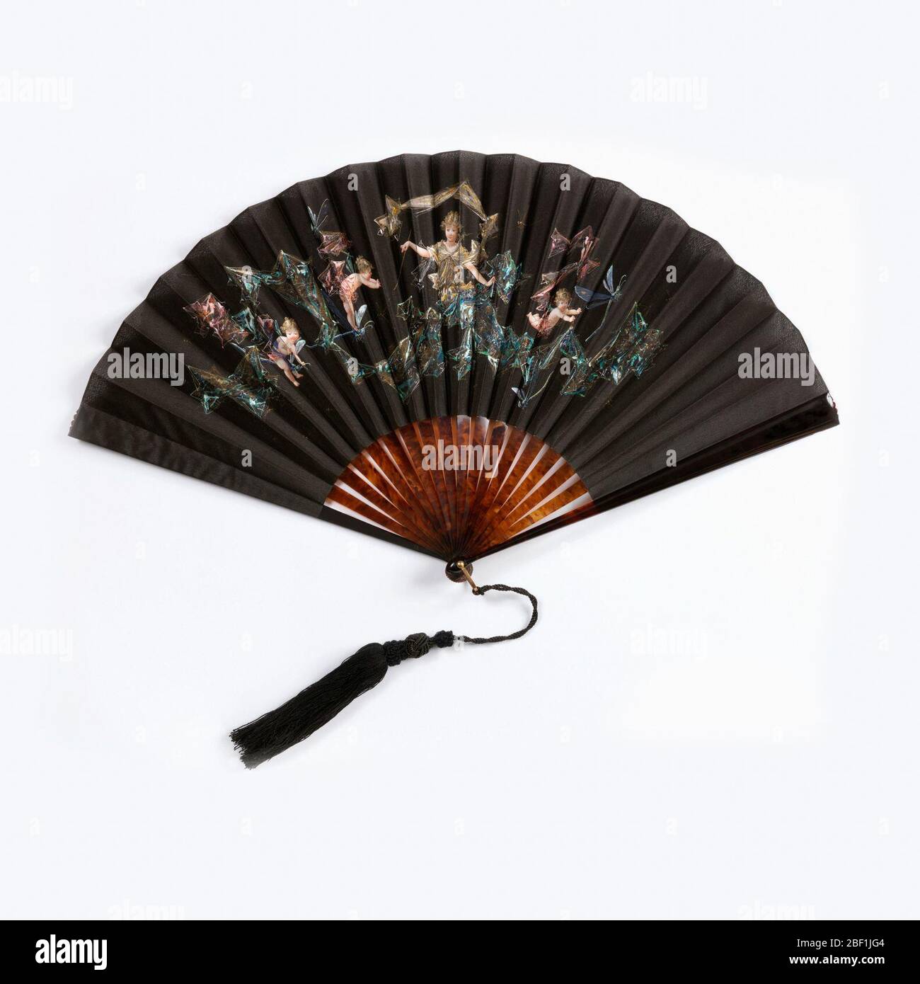 Pleated fan and box. Pleated fan with black silk leaf. Obverse: scene of a fairy and three cupids surrounded by gauze-like drapery. Reverse: plain. Sticks and guards are plain tortoise shell. Plain metal pin with black silk and fancy tassel. Stock Photo