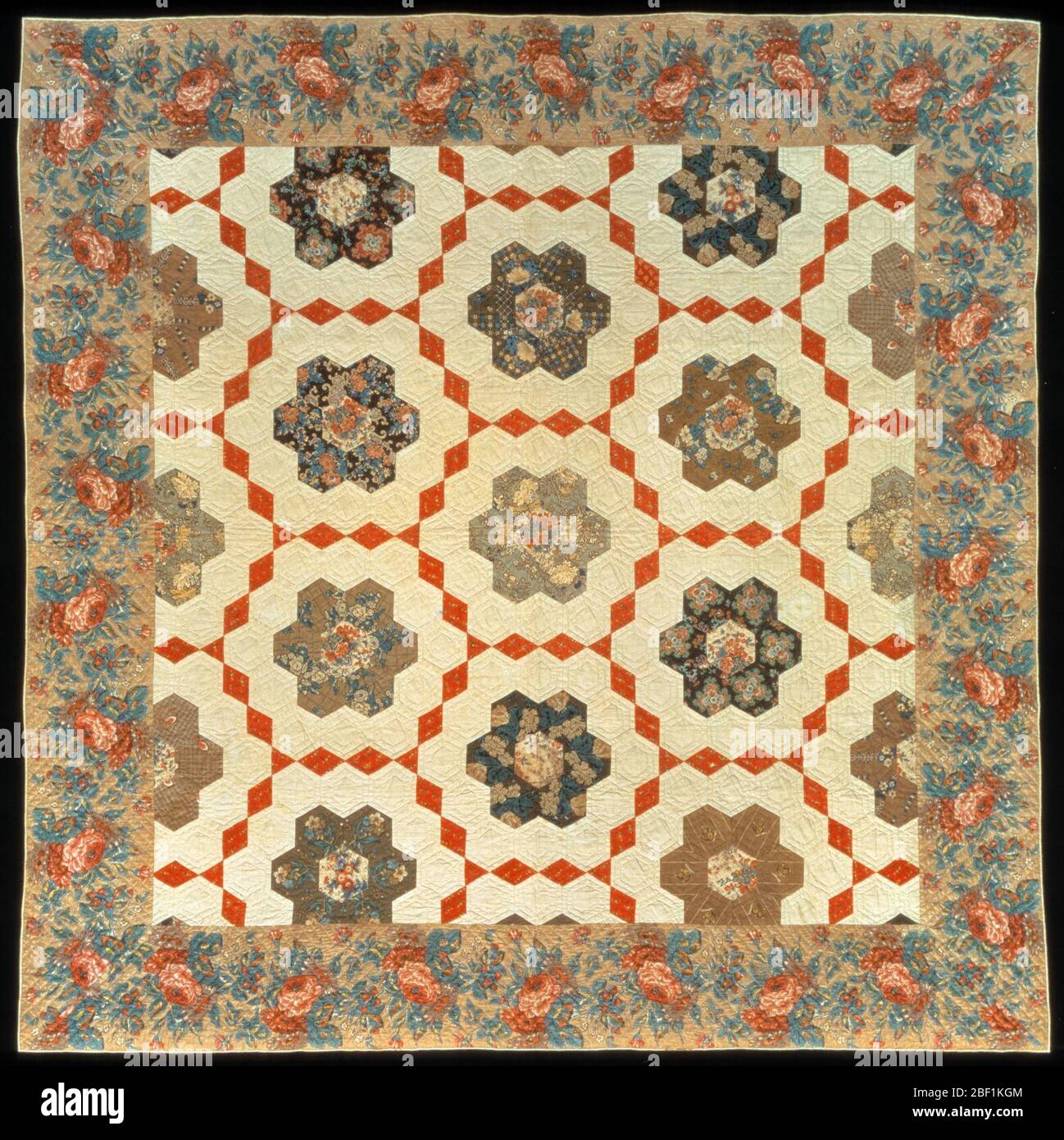 Pieced Quilt Honeycomb. Both Flying Geese and Honeycomb are examples of patterned American quilts made from luxurious samples of calicoes and chintzes imported from France and England. Stock Photo