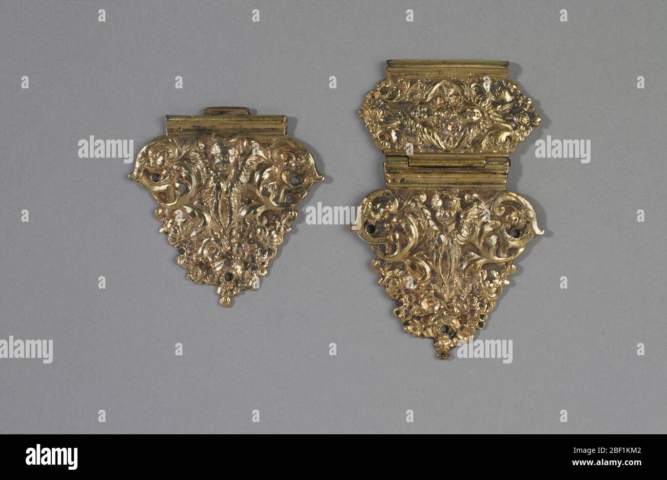 Book clasp. Two hinged parts of triangular clasp, relief decorated with