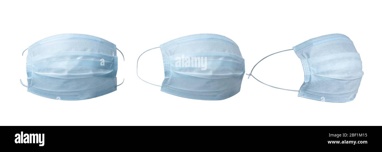 Set of blue anti virus surgical face masks, isolated on white. Stock Photo