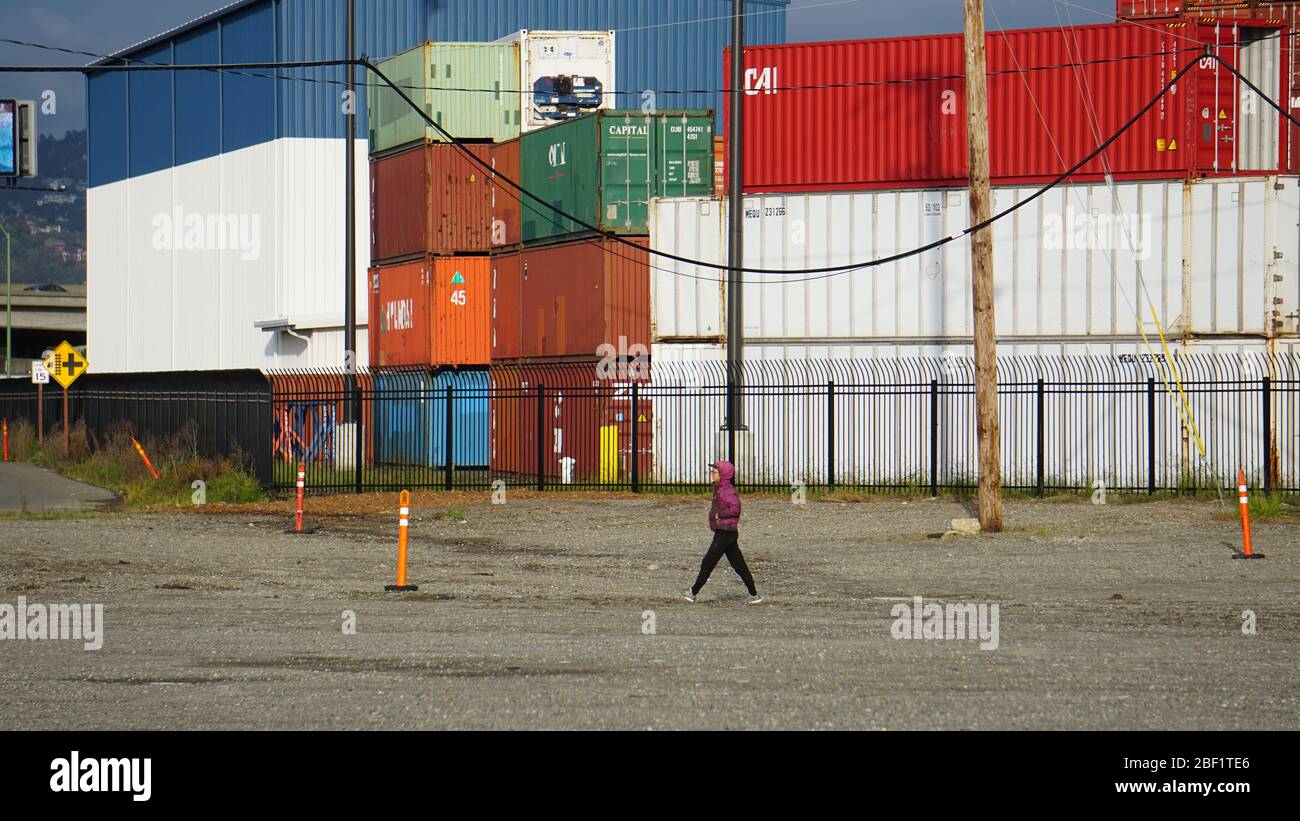 International shipping container terminal. Stacks of intermodal containers used for global trade and cargo commerce. Outer Harbor, Port of Oakland. Stock Photo