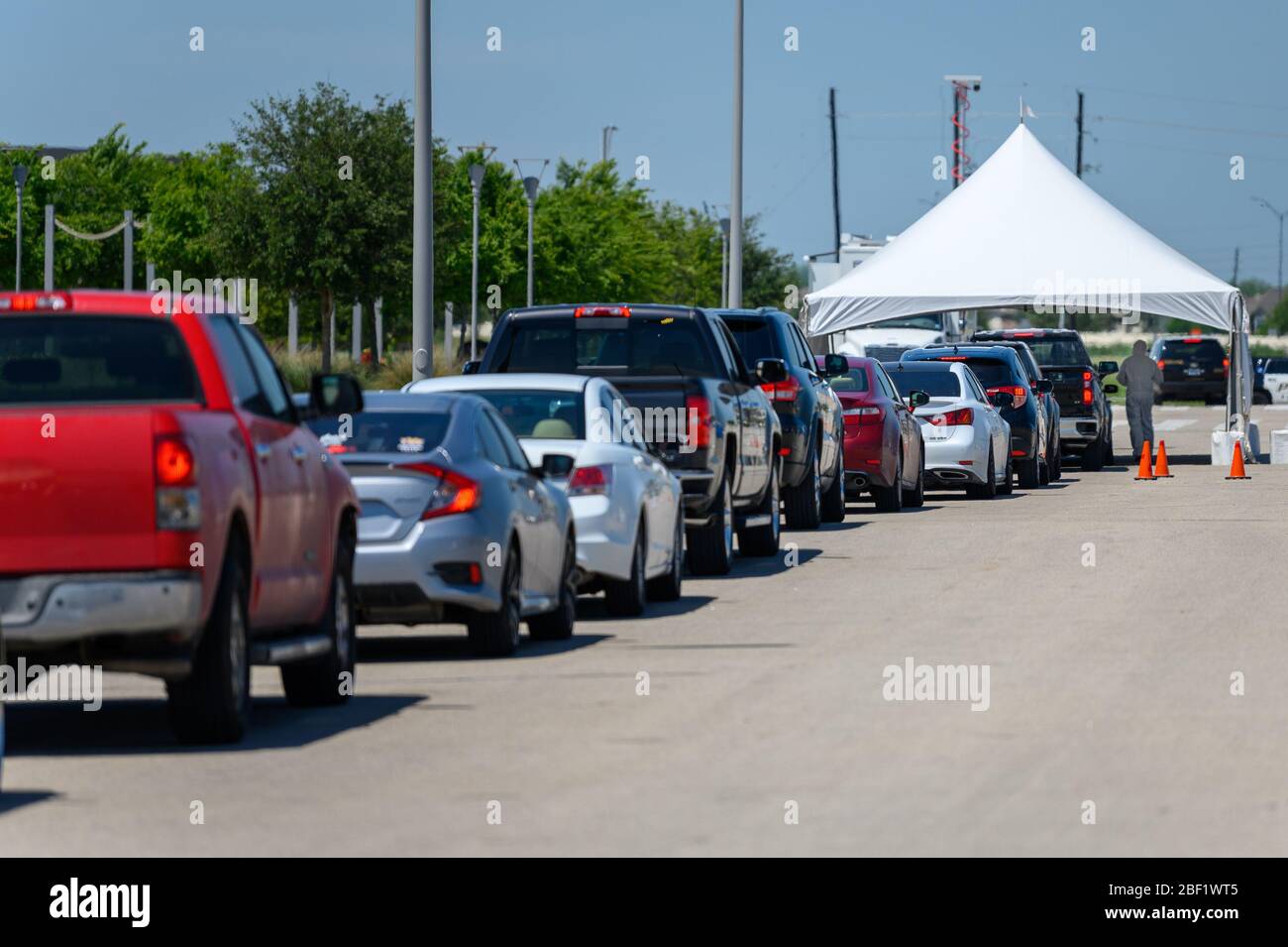 Sugar Land, Texas - April 16, 2020: Cars line up at city COVID-19 drive-through testing center Stock Photo