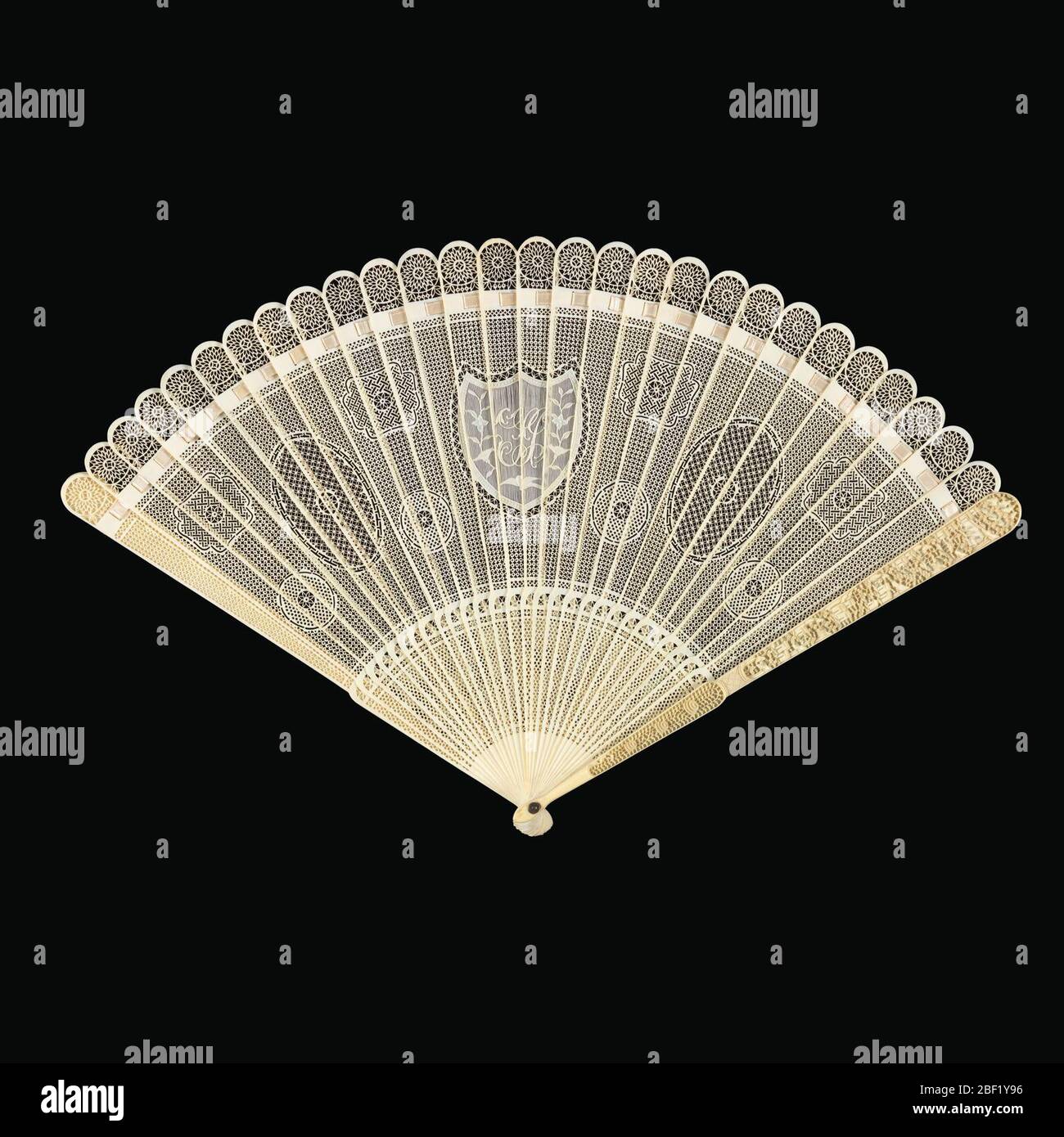 Bris fan. Brisé fan. Sticks of lacecarved and pierced ivory with