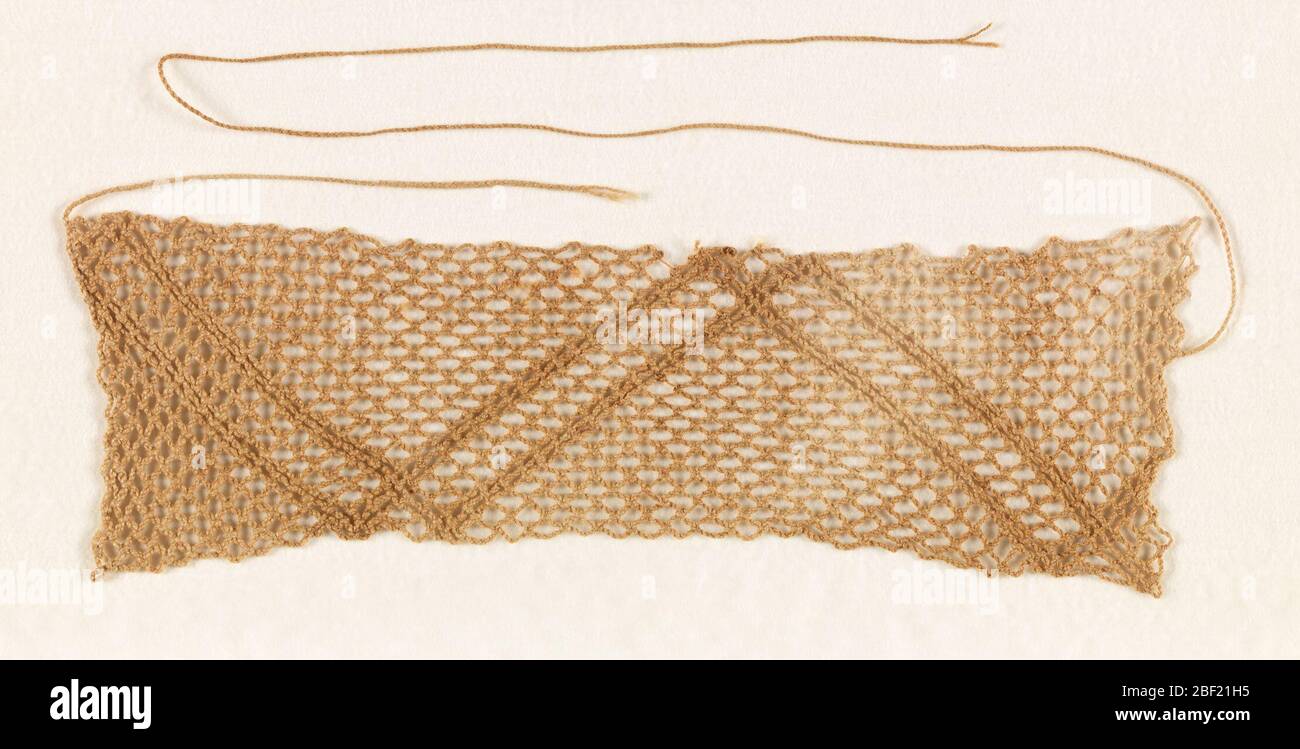 Netted textile. Netted panel with a pattern of parallel zigzag lines ...