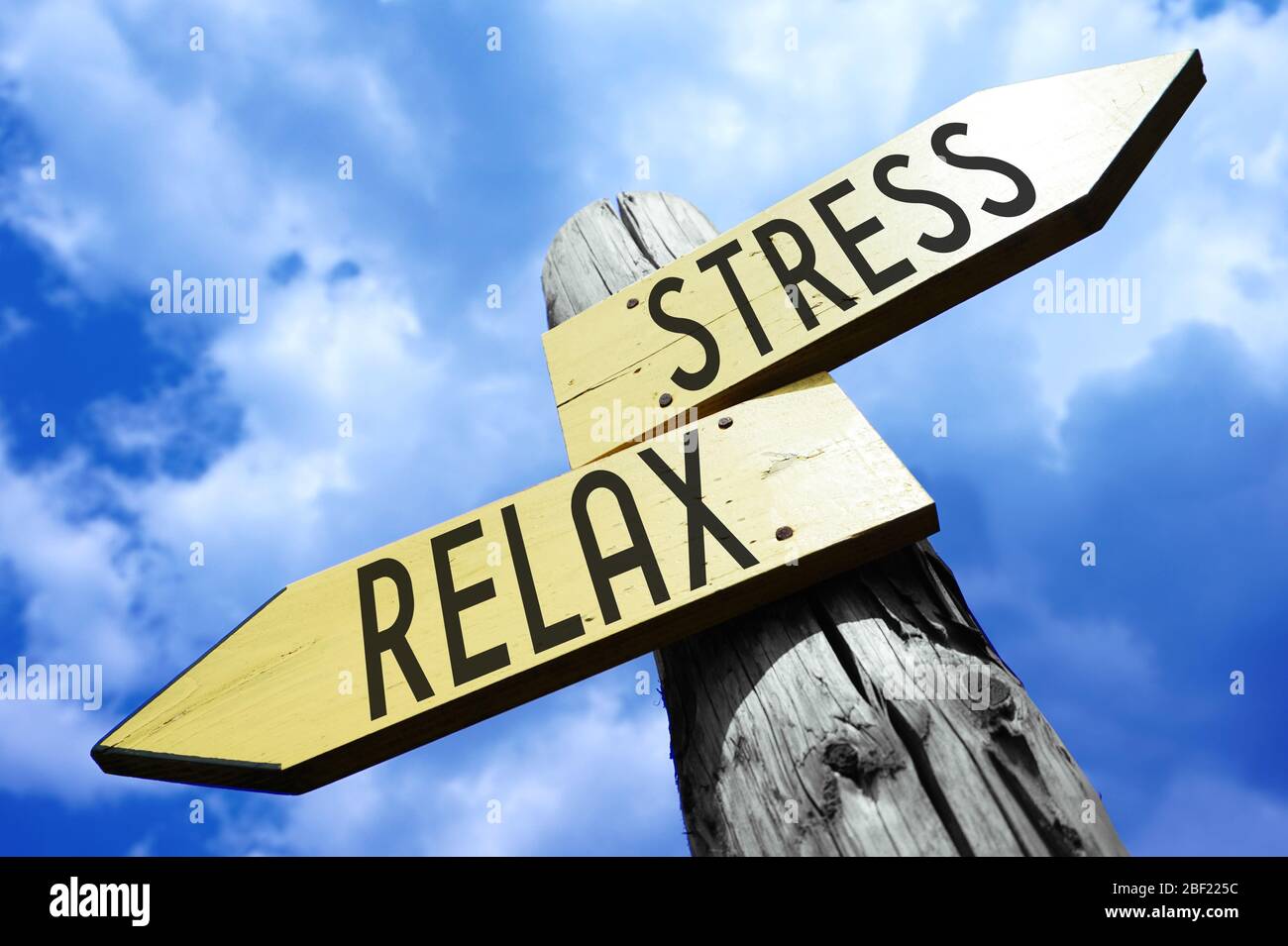 Stress, relax - wooden signpost Stock Photo