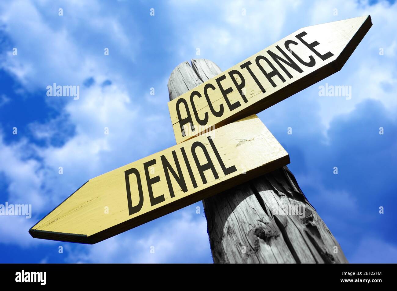Acceptance, denial - wooden signpost Stock Photo