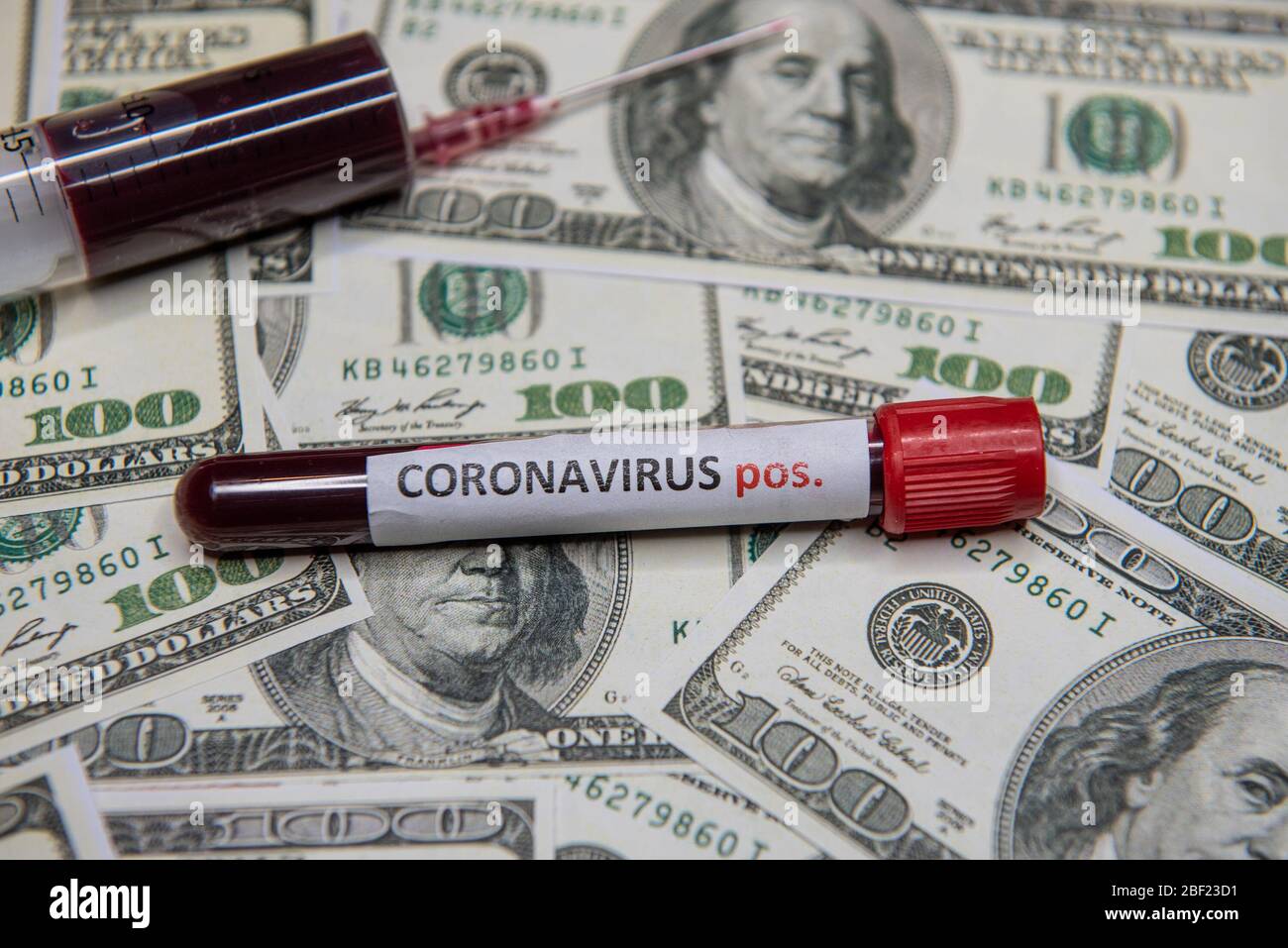 The economic situation of the dollar and the positive test at coronavirus. Stock Photo